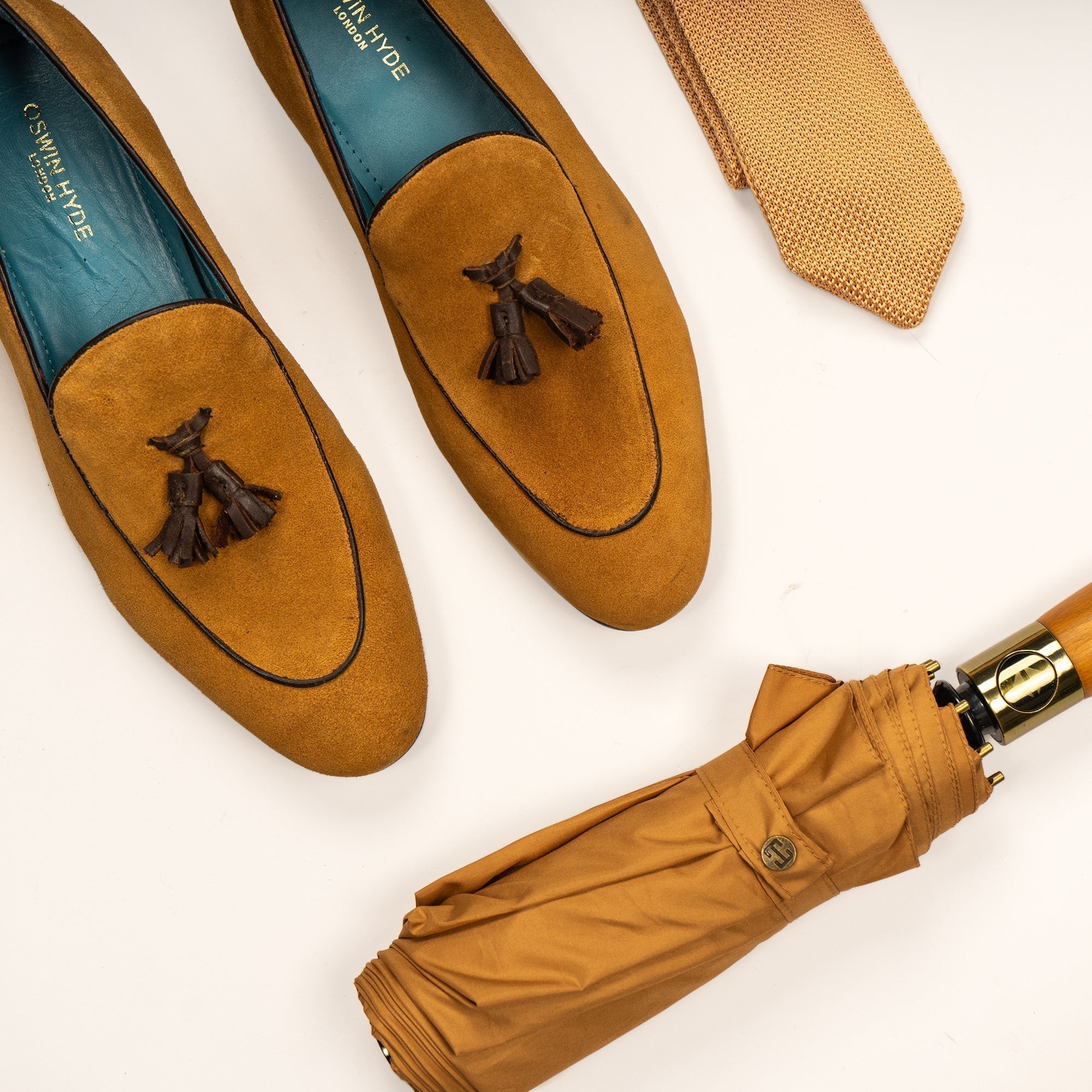 Pair of tan loafers, tie, and umrella - Oswin Hyde