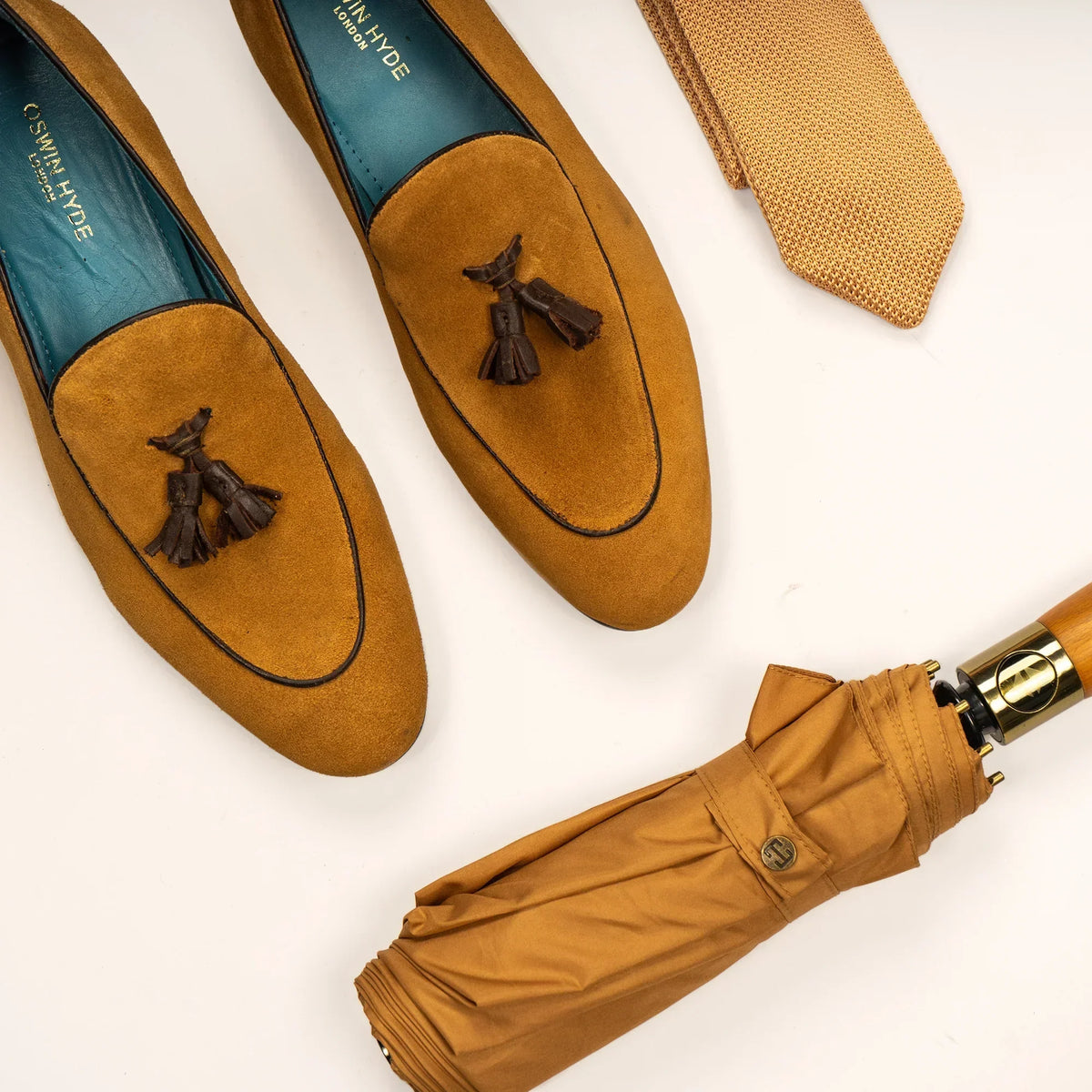 Matching brown leather belt and shoes by Oswin Hyde