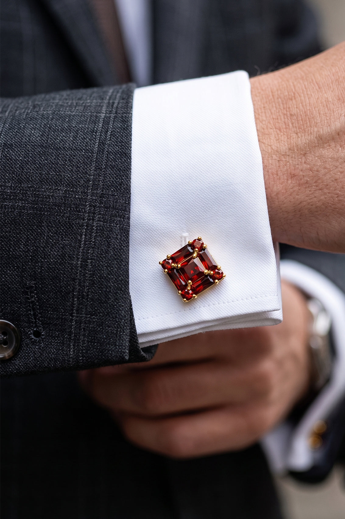 Close‑up of Zirc Ruby men’s cufflinks with deep ruby gemstones set in intricate metalwork for formal sophistication and luxury.