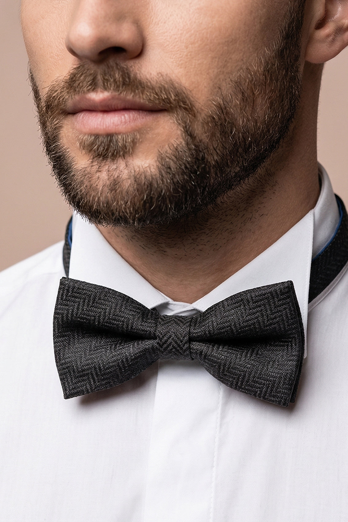 Oswin Hyde Herringbone Black Bowtie, featuring a classic herringbone pattern. deep black colour and textured fabric with an intricate design