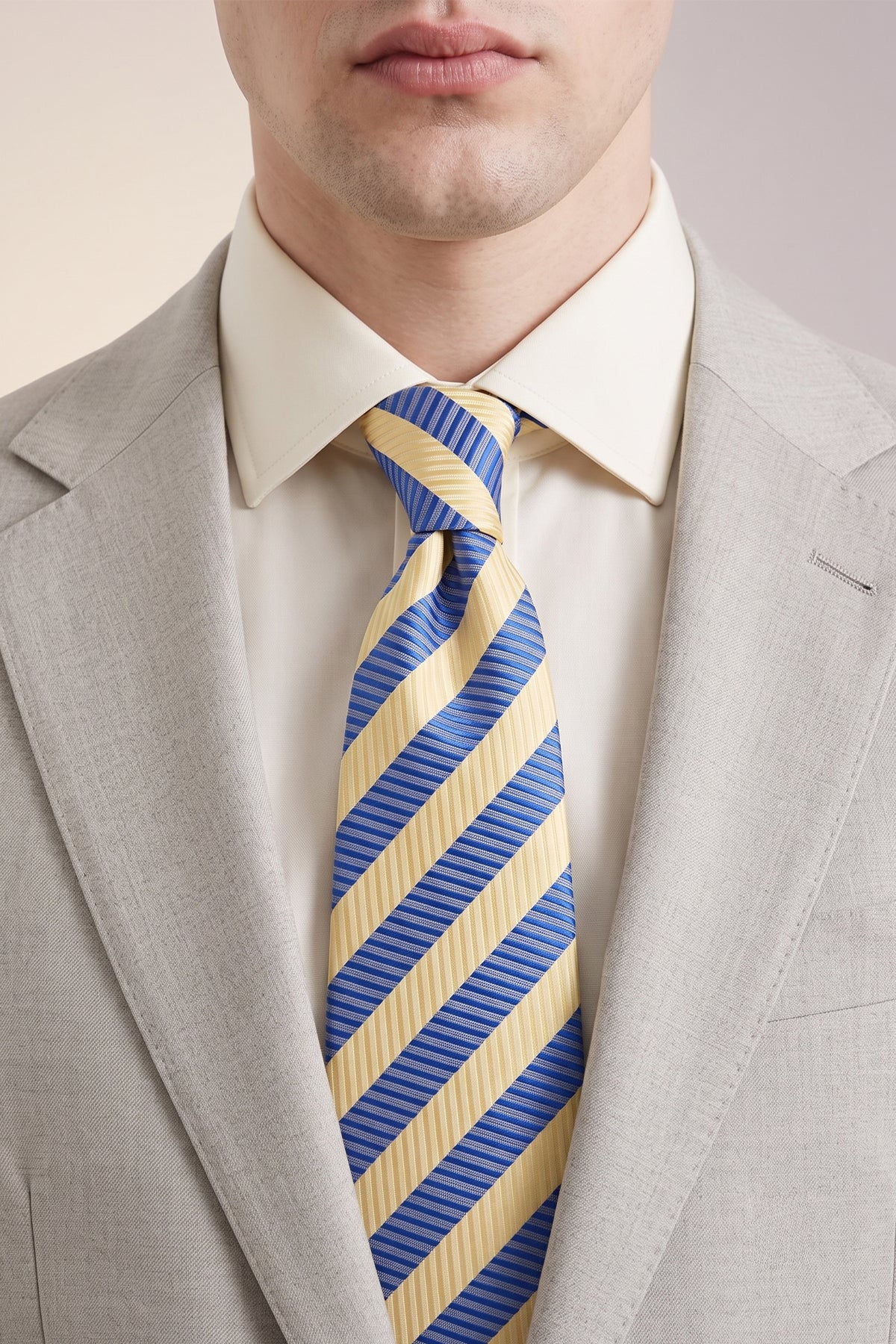 Man wearing Vintage Stripe Navy Cream tie with sophisticated design, ideal for weddings, office wear, and formal occasions.