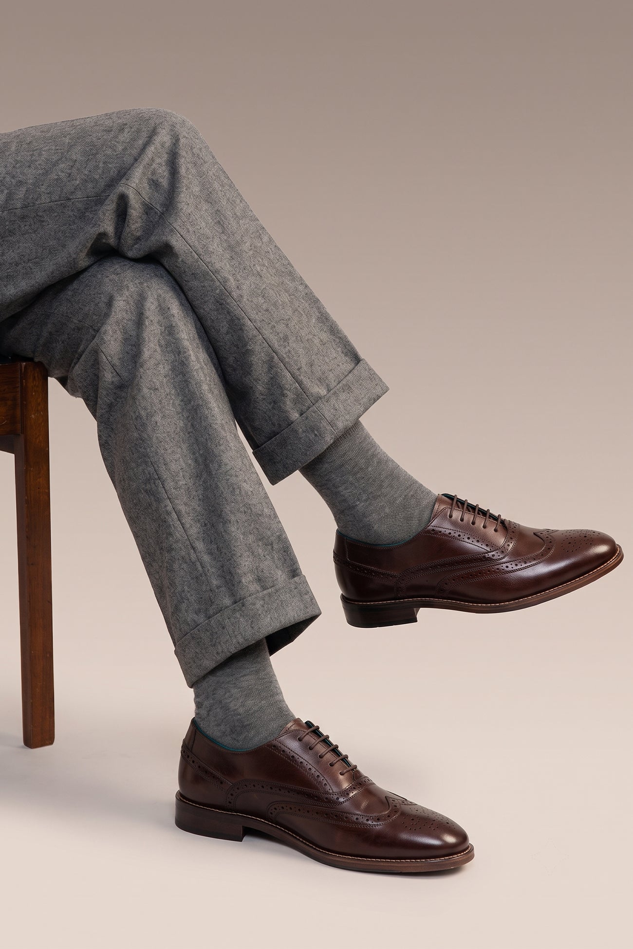Model wearing Winston Brown brogue. Premium leather, classic brogue detailing, and extra room for all-day wear.