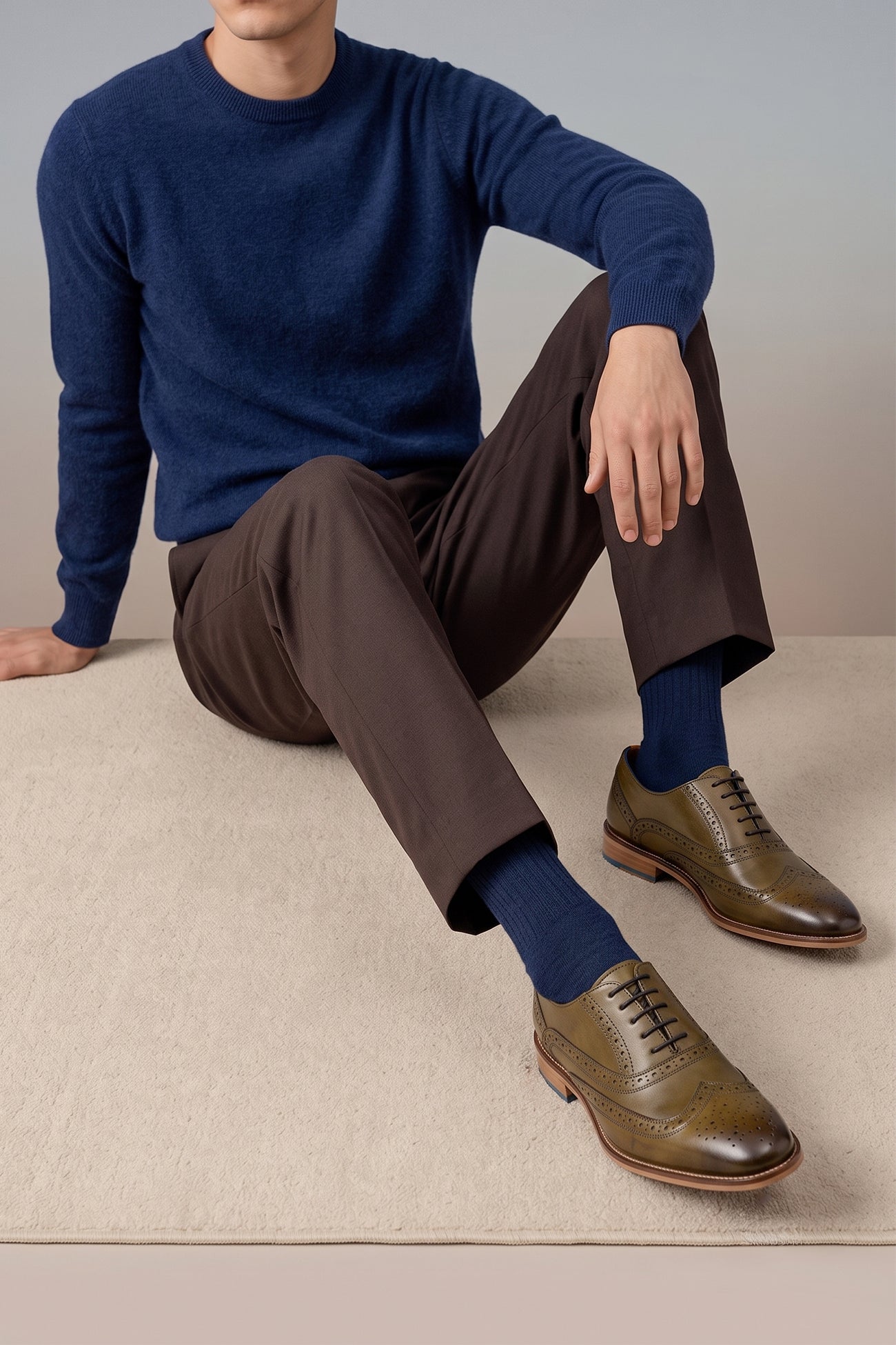 Model wearing Winston men’s Oxford brogue shoes in green leather with wingtip detail, perforated accents, and a classic lace-up silhouette—crafted for formal distinction.