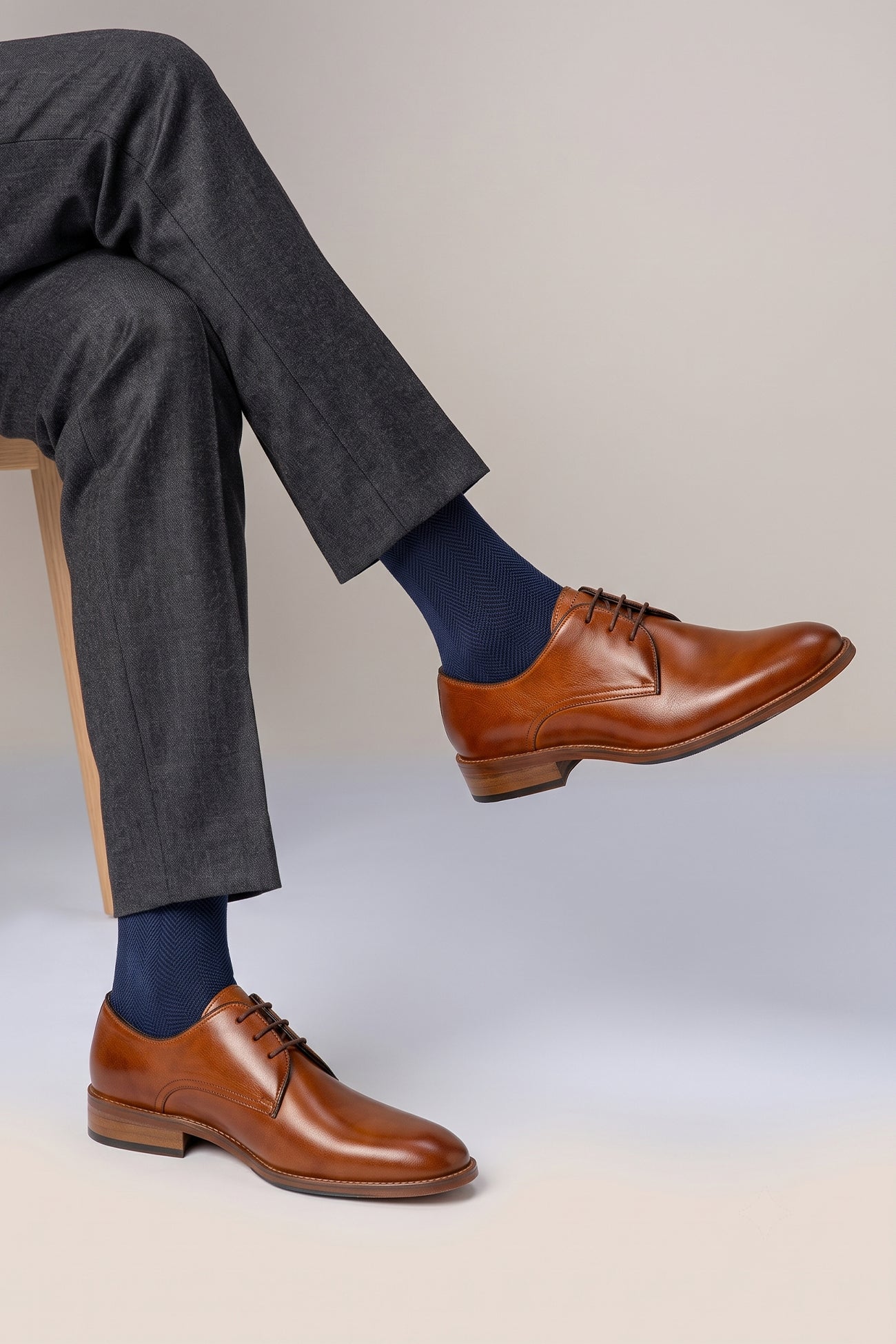 Model wearing Edison tan leather Derby shoes for men featuring a 3-eyelet design, breathable lining, and durable leather sole for formal and smart casual occasions.