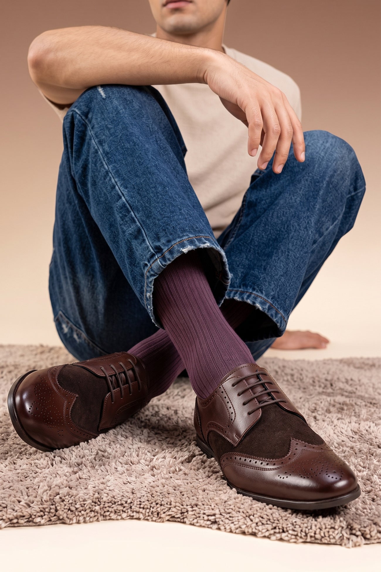 Model wearing Miller Brown Suede men’s leather and suede brogue shoes with wingtip detailing.