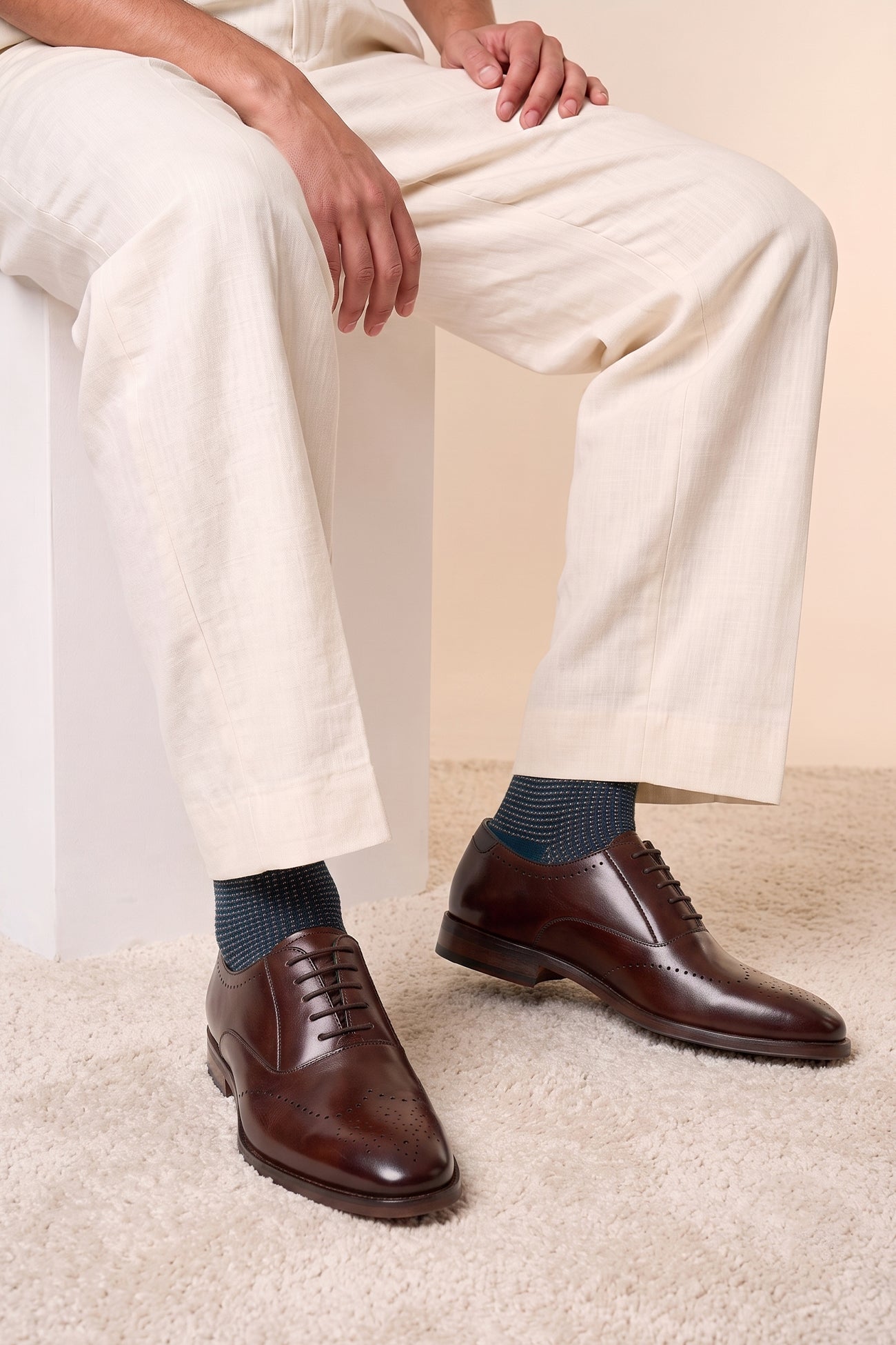 Model wearing Dean Brown men’s Oxford leather shoes in rich brown, crafted with premium leather for formal and smart casual occasions.