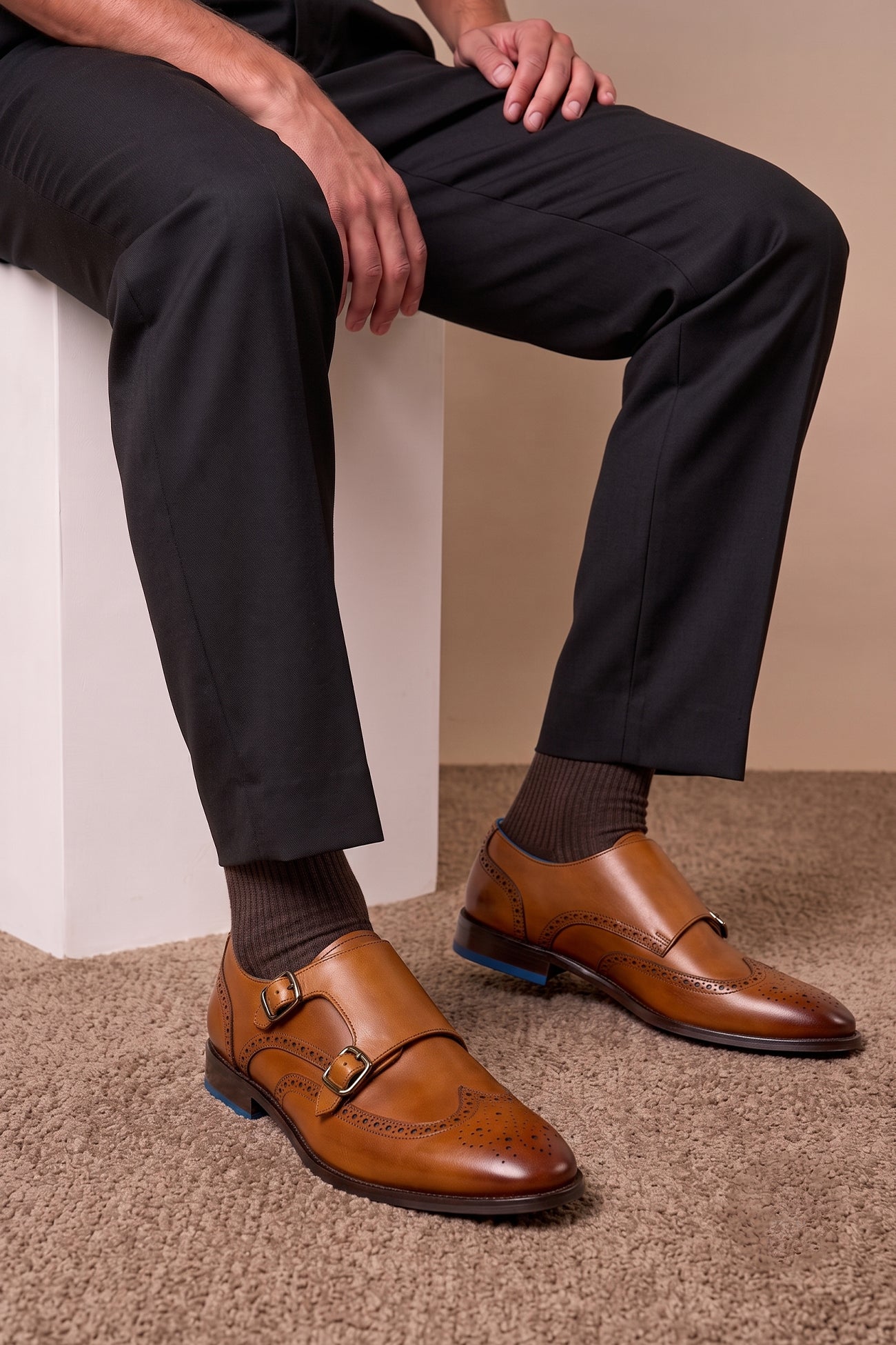 Crafted in rich tan leather, the Warren Monk Strap Brogue blends classic broguing with modern monk straps—ideal for men seeking stylish, versatile formal shoes.