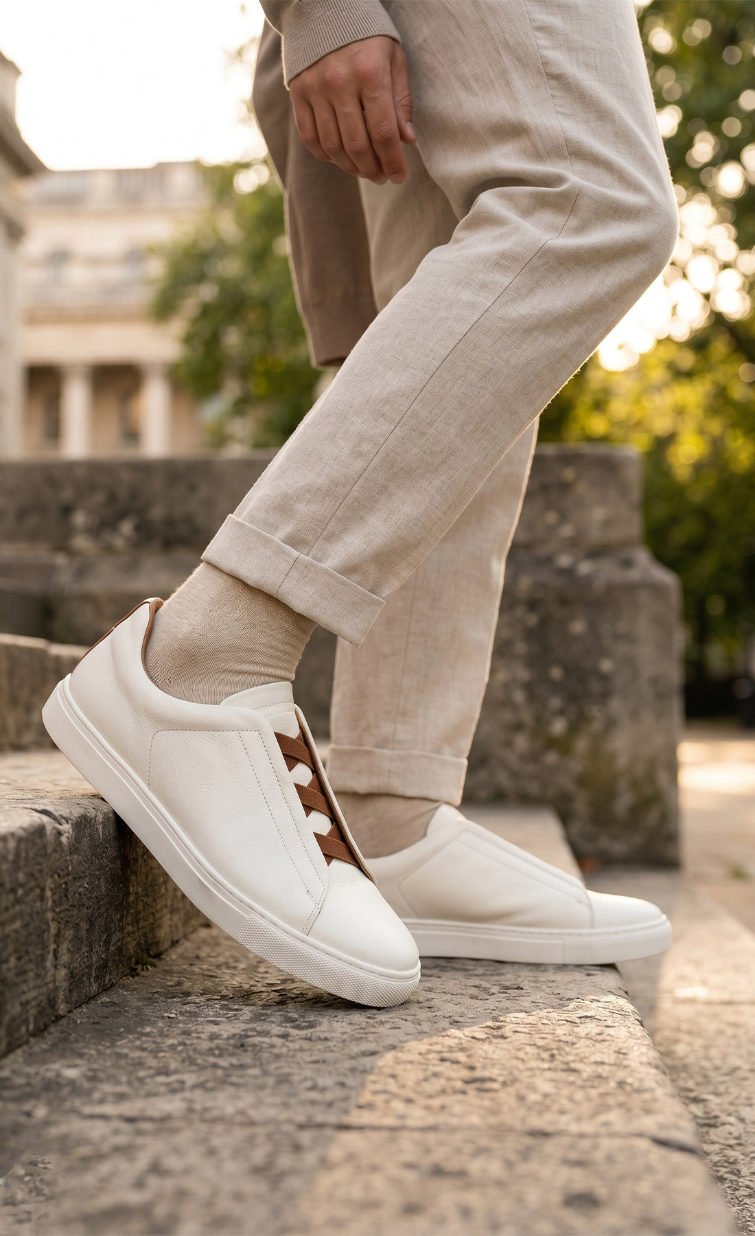 Model wearing Smudge White is crafted from soft, milled leather, perfect for both casual and formal occasions. No need to tie laces, secure elasticated fit