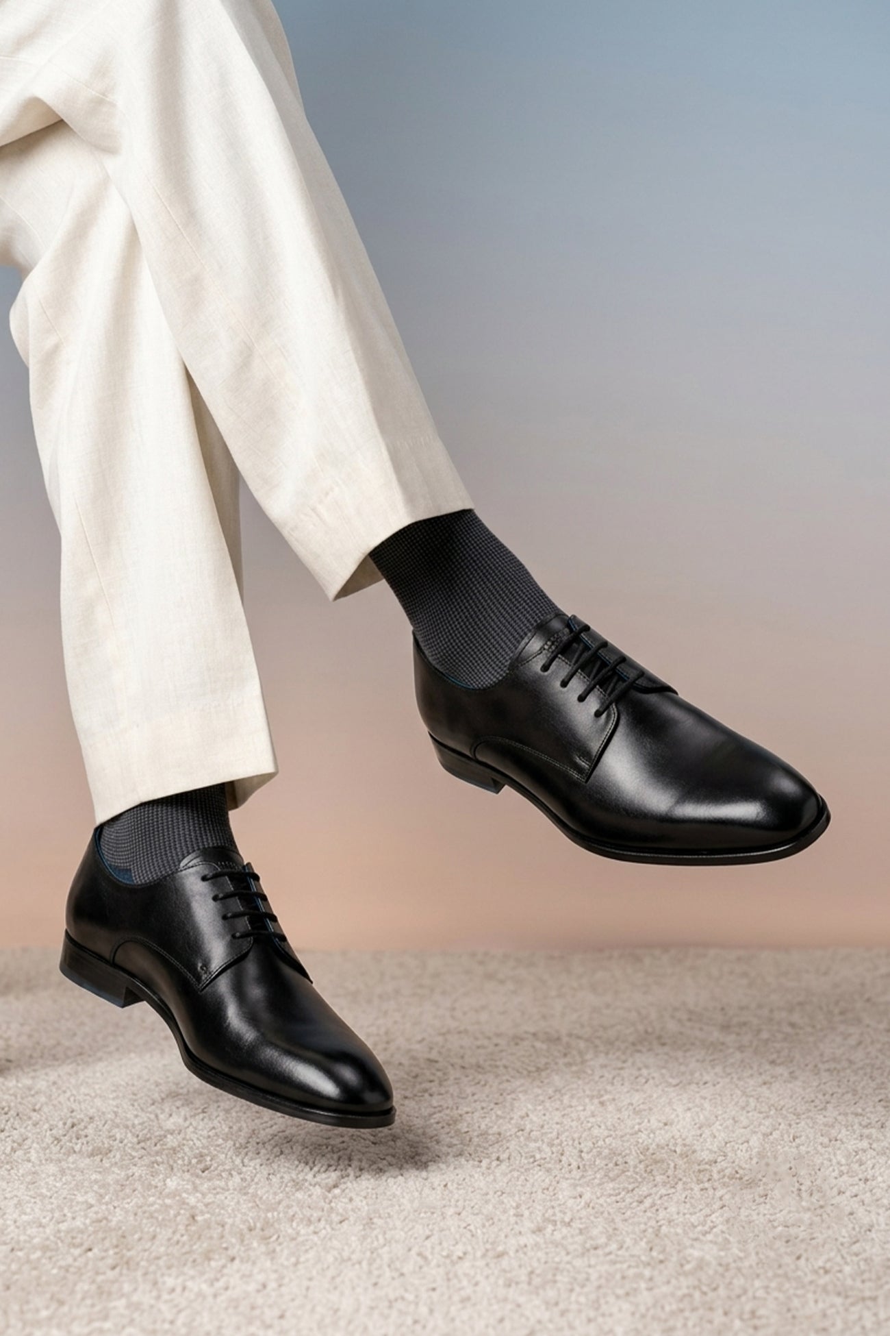 Model wearing Keyon black men’s derby lace-up leather shoes with classic design, ideal for formal occasions and office wear.