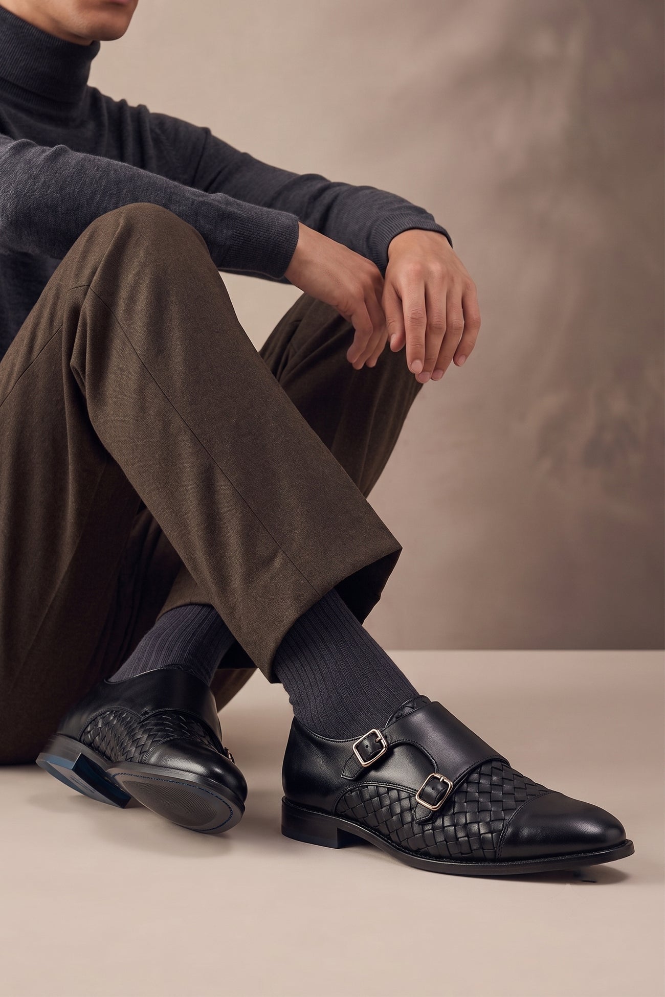 Model wearing Hudson Black men’s leather monk shoes with woven toecap detail, crafted from premium leather for formal and smart wear.