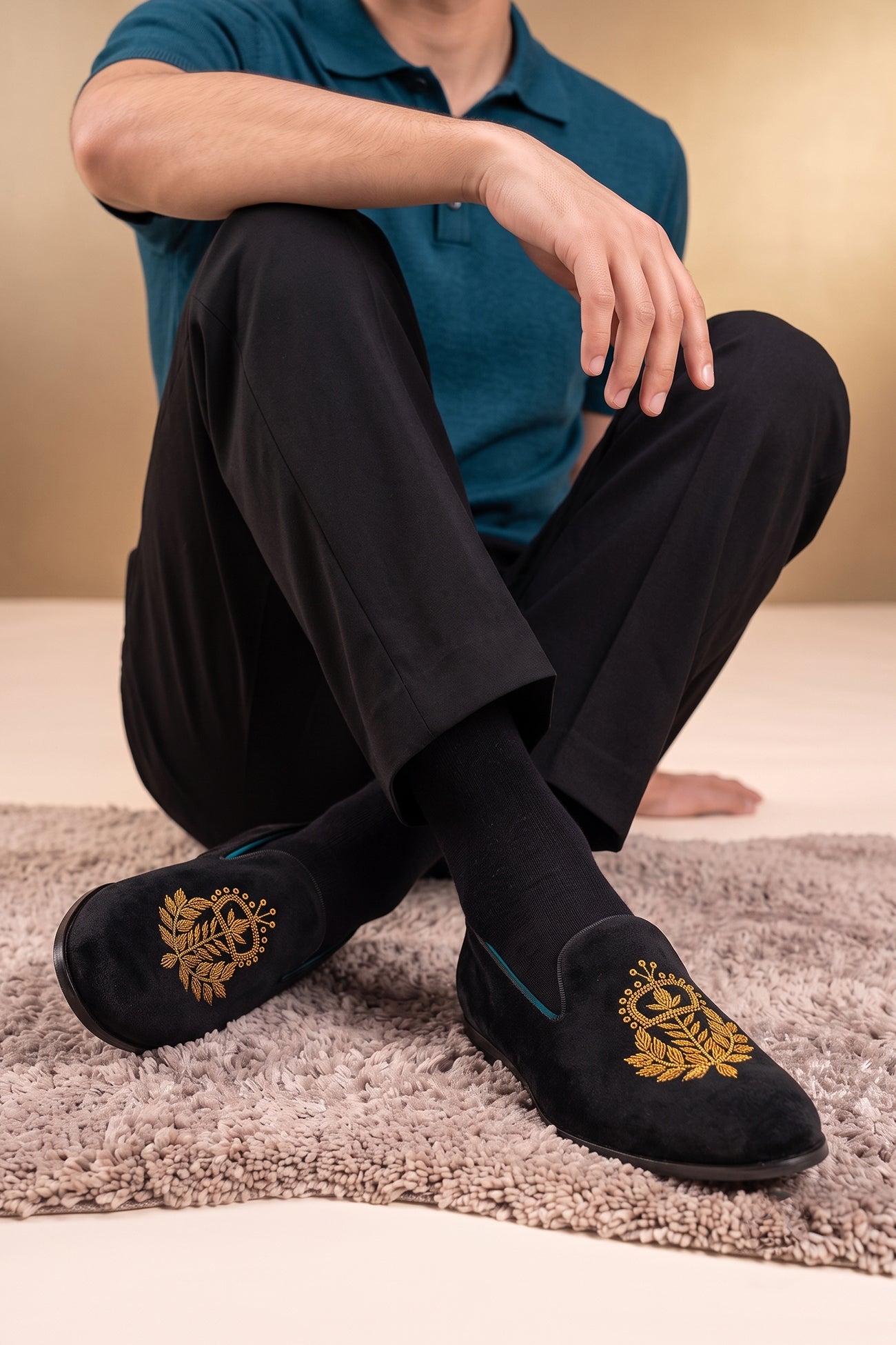 Man wearing Archer Black velvet slip-on loafers for men featuring plush velvet material and elegant design, ideal for formal and smart casual occasions.
