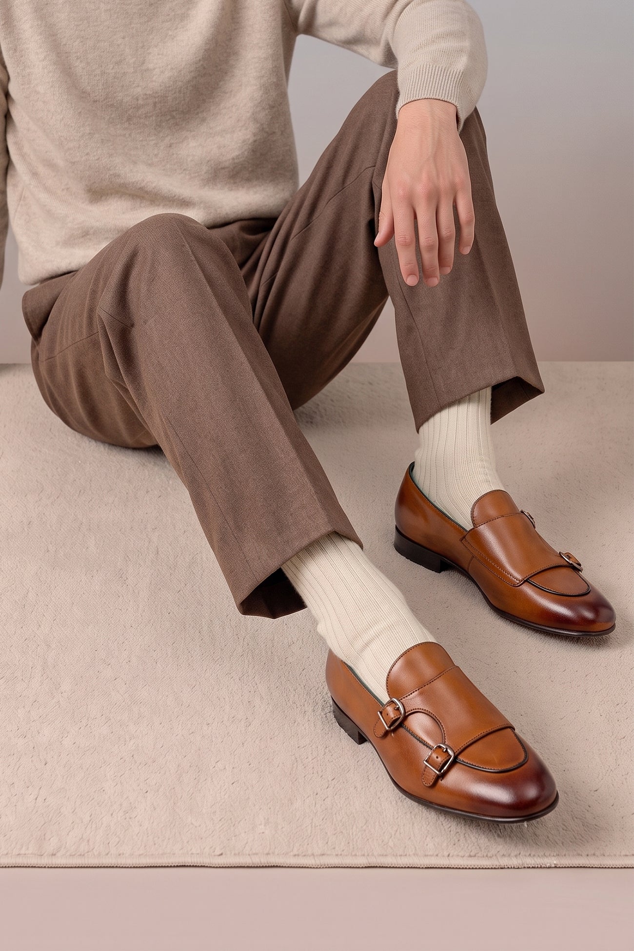 Model wearing Clifford Tan monk leather loafers for men crafted with premium tan leather and classic monk strap design, ideal for formal and smart casual wear.