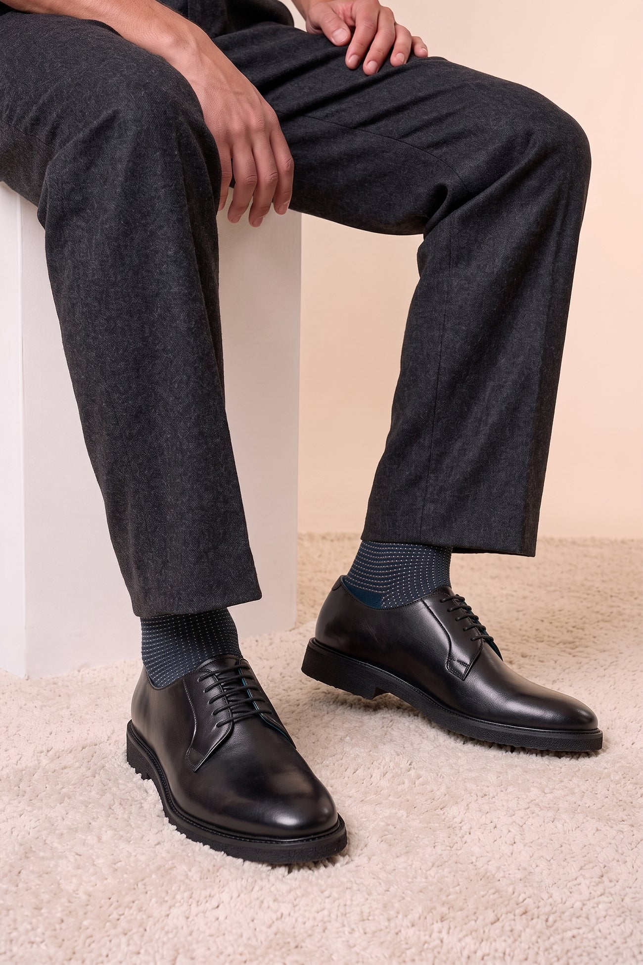 Model wearing Darren Black men’s derby leather shoes crafted from premium black leather, featuring classic derby design ideal for formal and smart casual occasions.