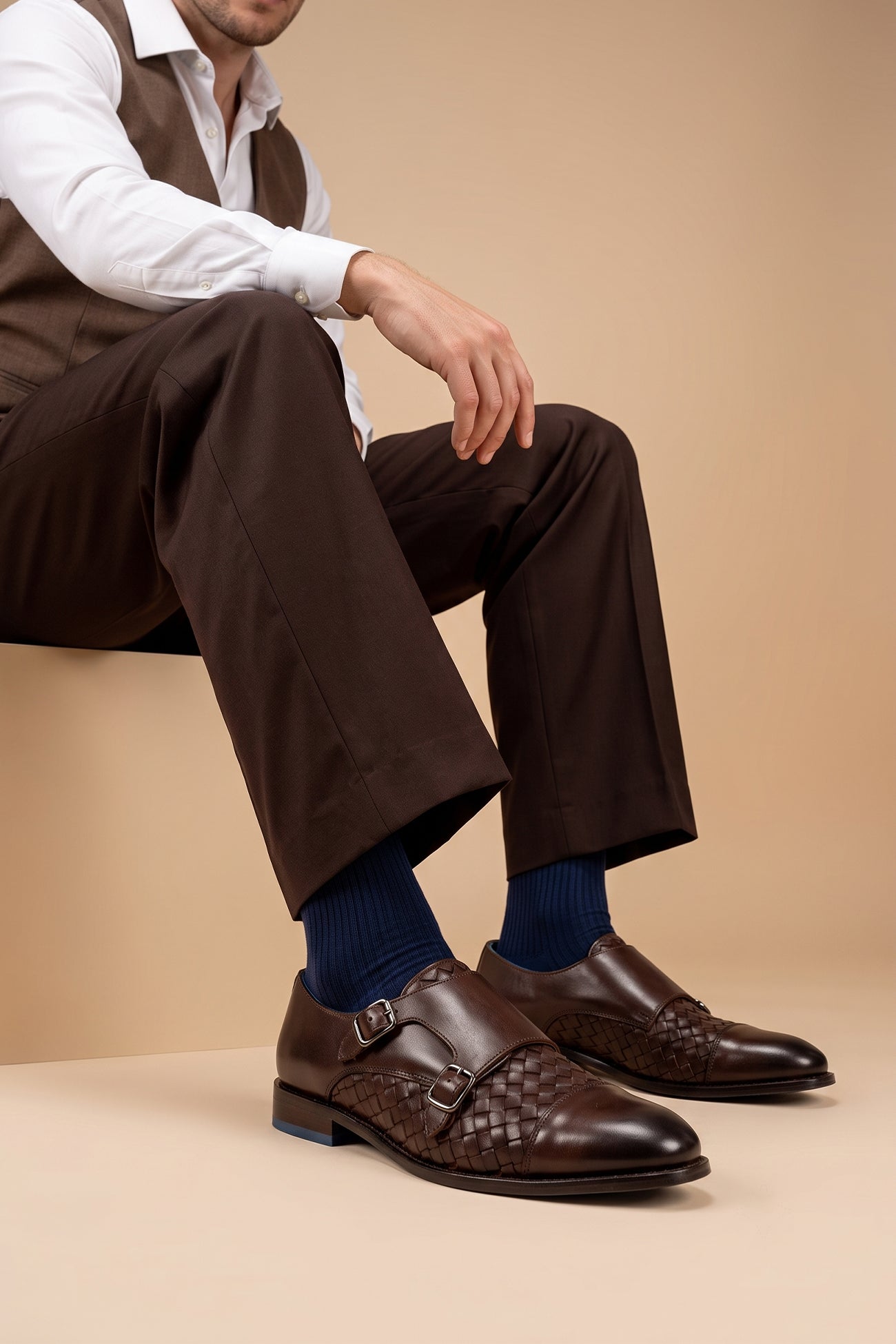 Model wearing Hudson brown woven toe cap monk leather shoes for men – premium leather shoes with a woven front design and elegant monk strap closure.