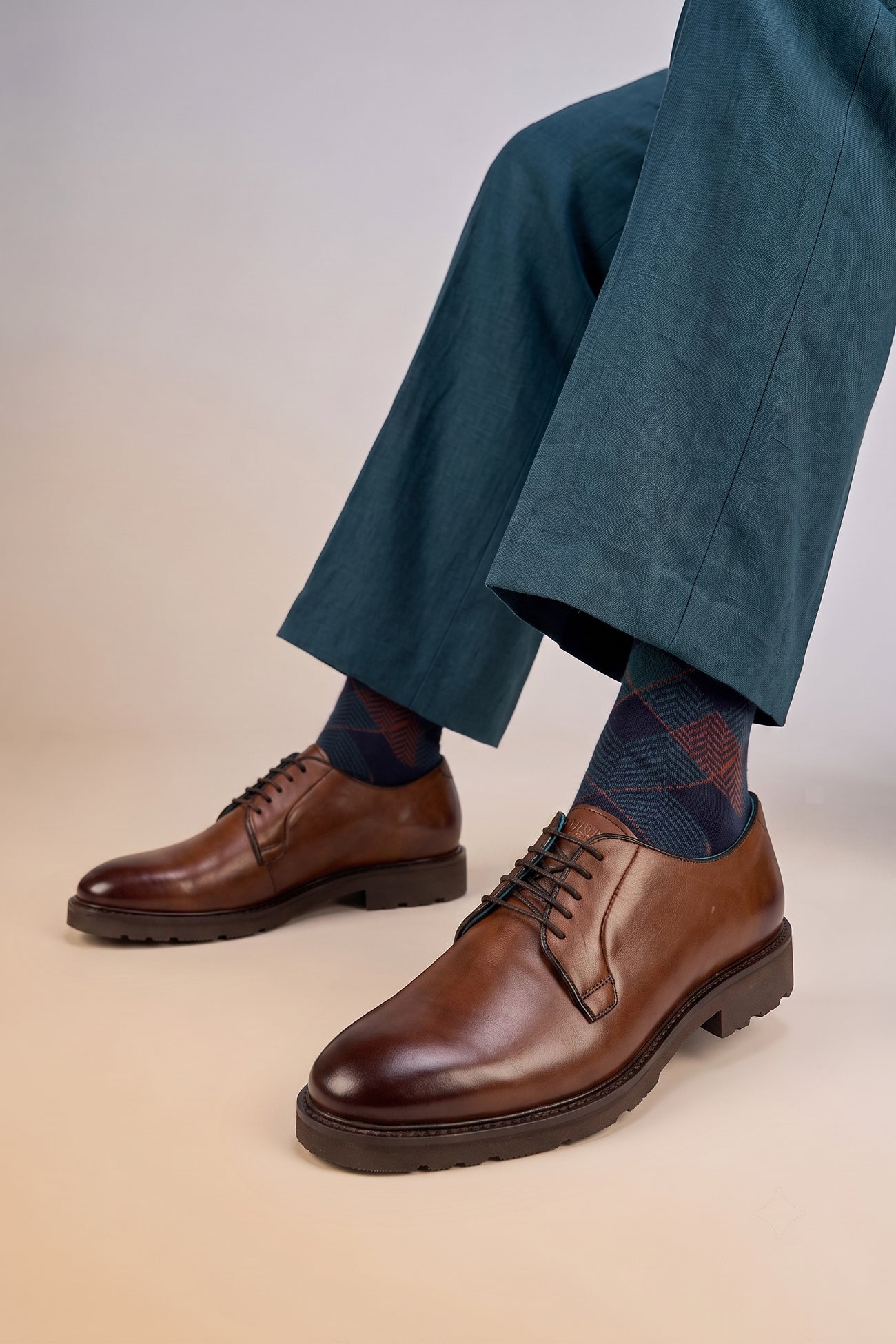 Model wearing Darren Brown men’s derby leather shoes in rich brown leather, ideal for formal and smart casual wear.