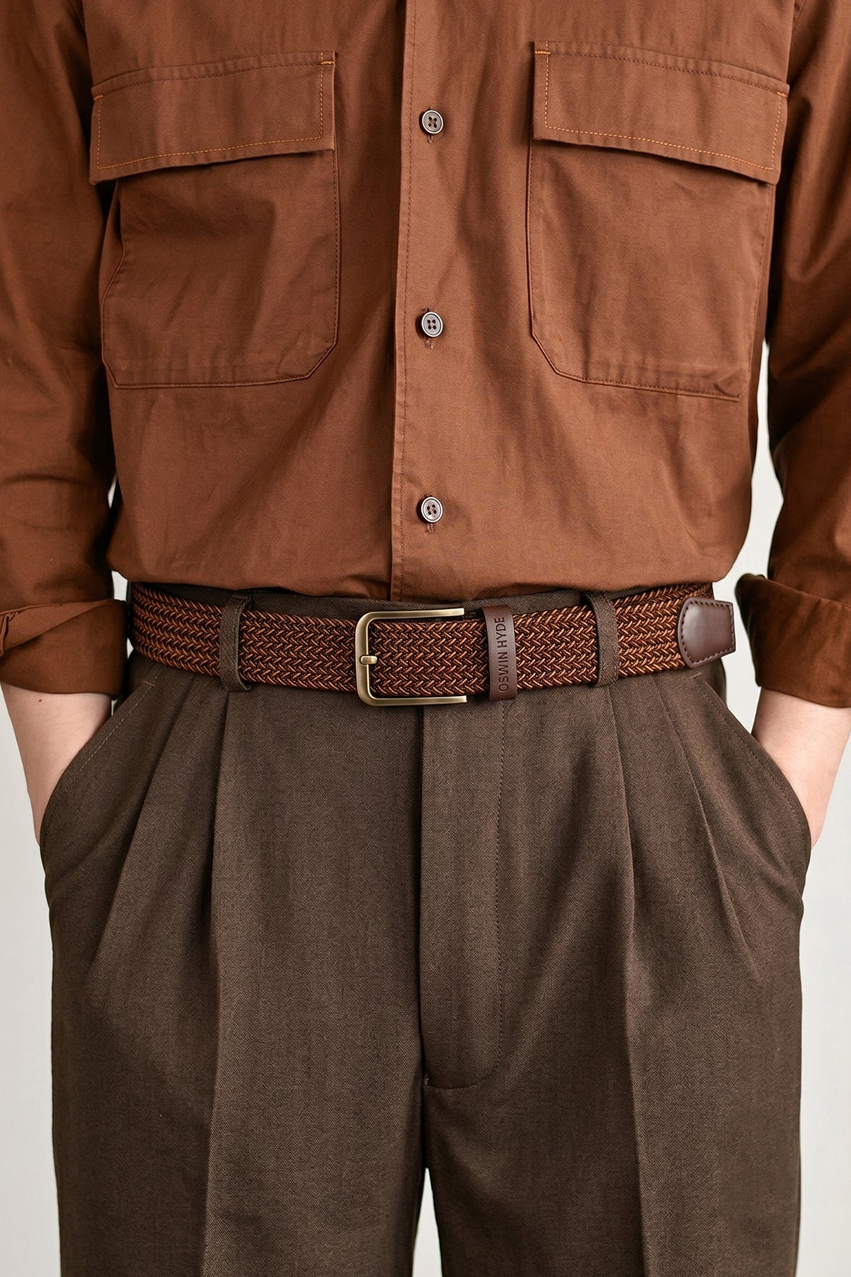 Model wearing Oswin Hyde Bert belt - Rich brown elastic webbing for weddings and smart-casual wear