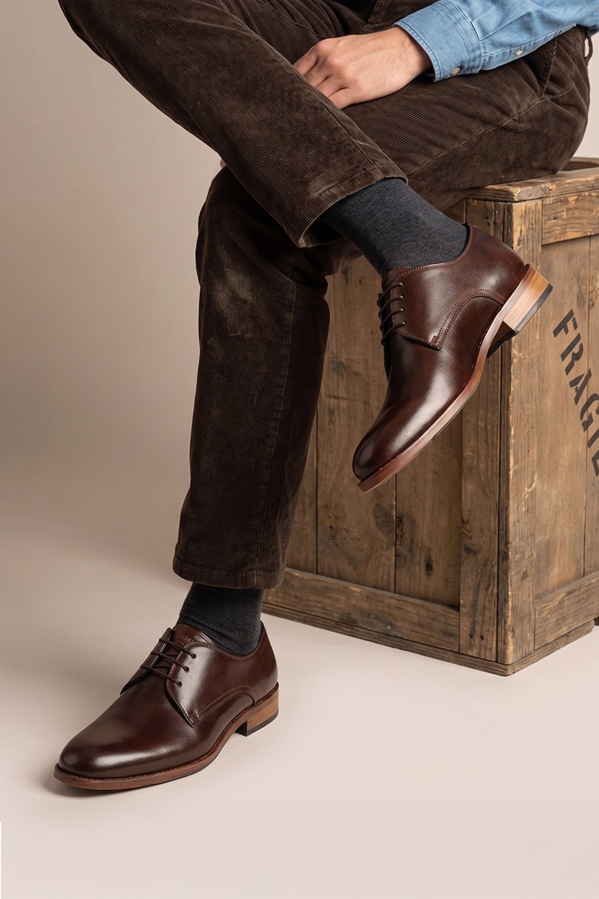 Man wearing Edison Brown men's derby leather shoes with 3-eyelet design crafted from premium brown leather, ideal for formal and smart casual occasions.