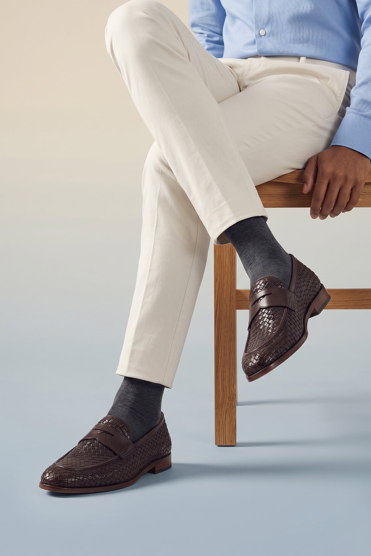 Man wearing Santiago Brown woven leather loafers for men featuring premium craftsmanship, unique textured design, and comfortable fit for versatile wear.