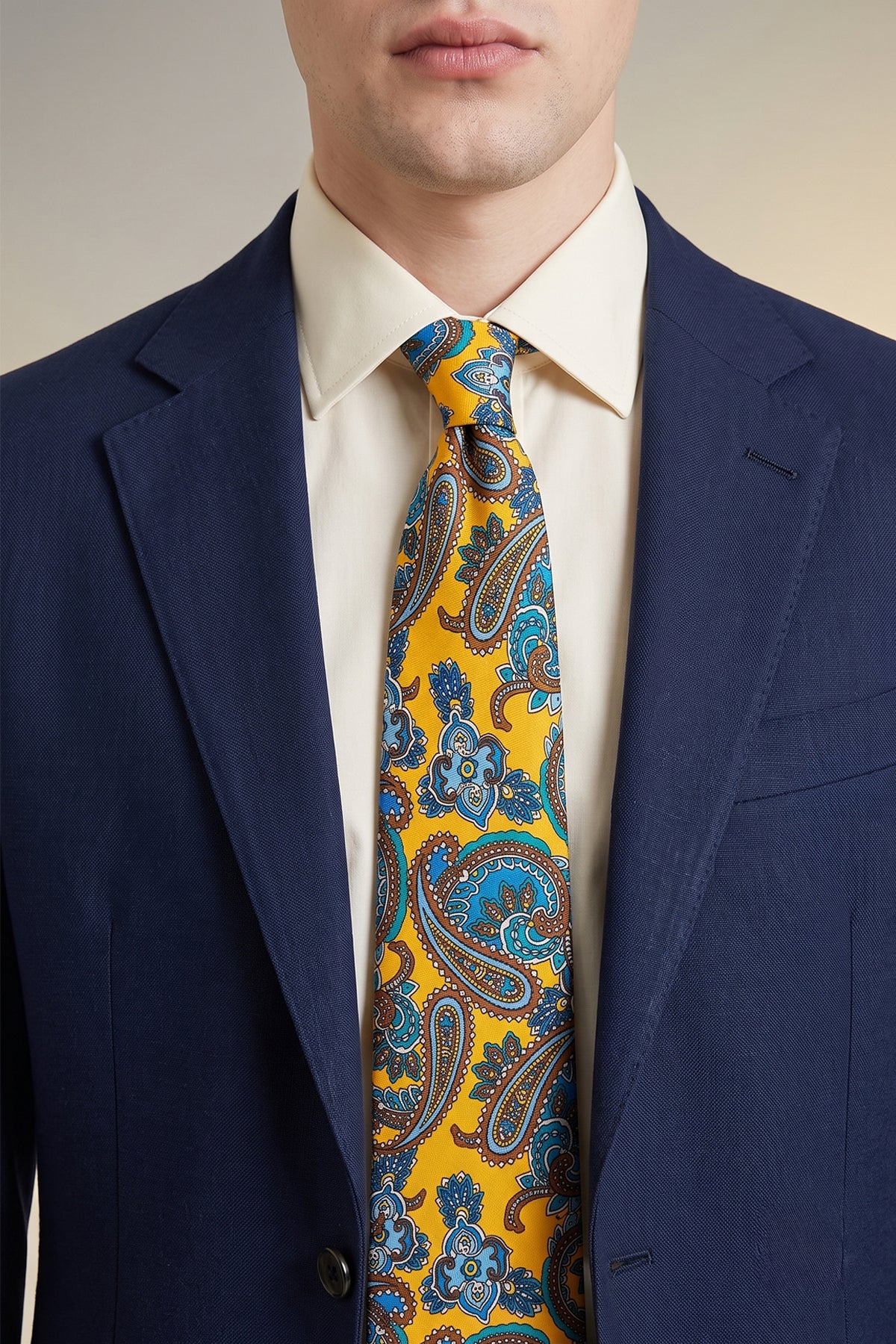 Man wearing Paisley Print Yellow tie with elegant design, ideal for weddings, office events, and casual wear.