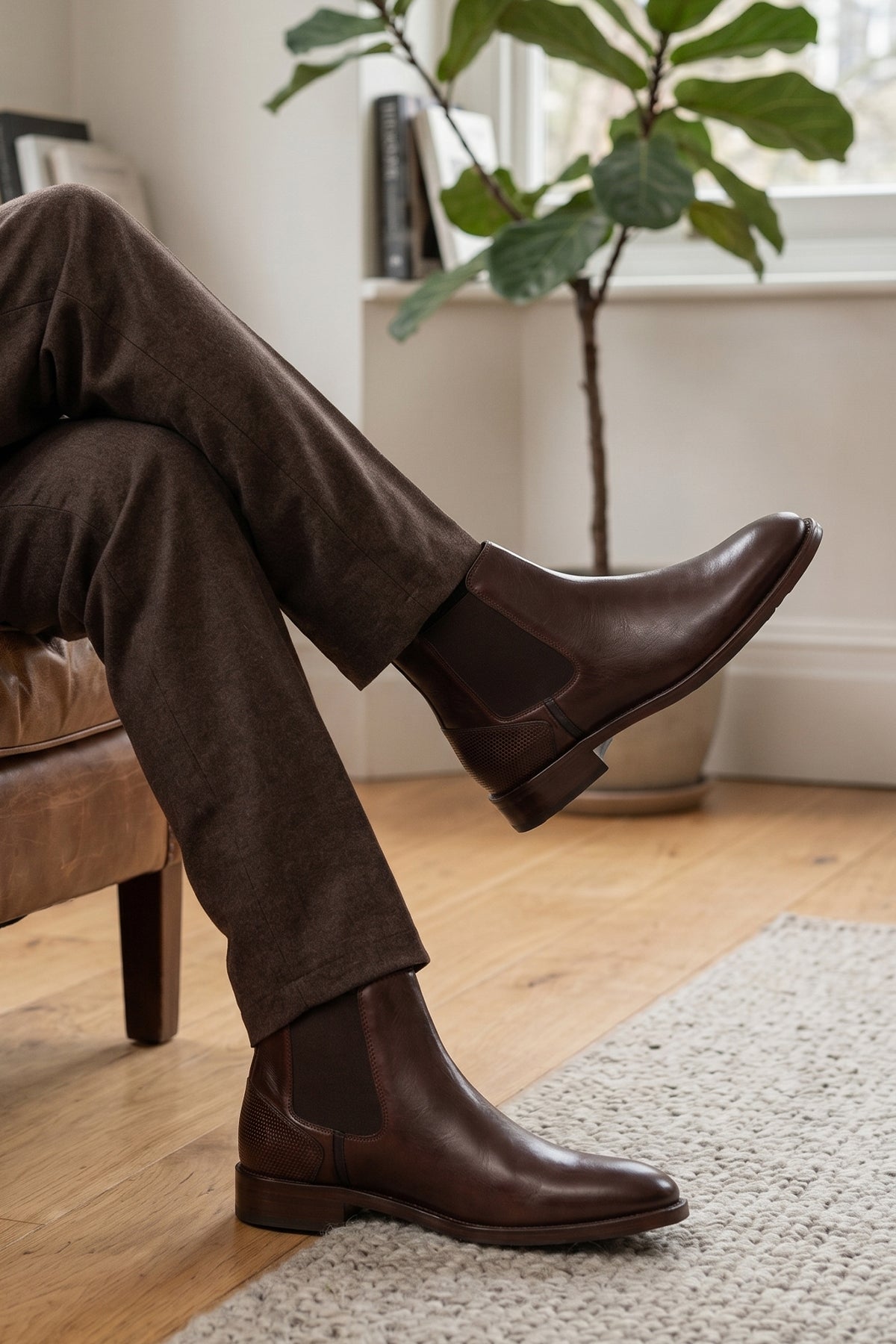 Man wearing Jack Brown leather Chelsea boots for men, featuring a handmade sole that delivers enhanced durability and comfort