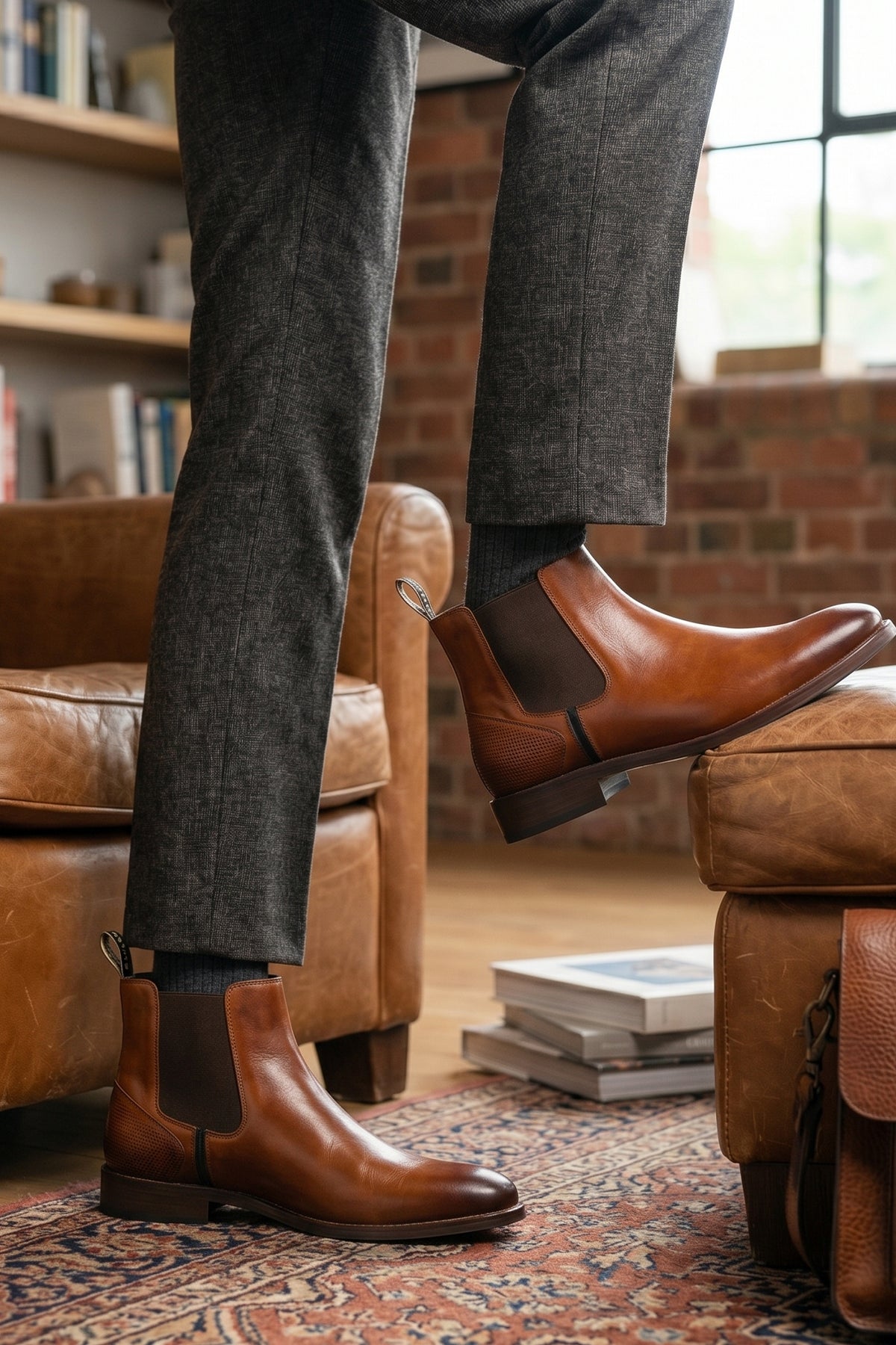 Man wearing Jack Tan Chelsea boots for men made with premium leather, lambskin lining, and a handmade sole—offering comfort, craftsmanship, and timeless sophistication.