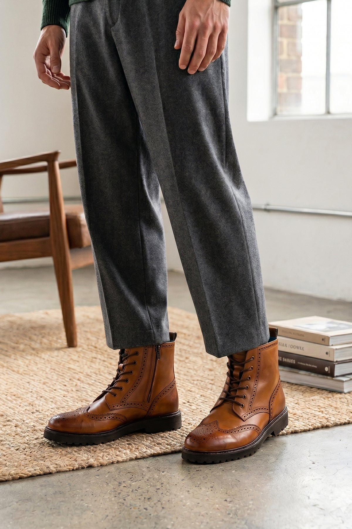 Man wearing Graham tan leather brogue boots for men with classic perforated detailing, ideal for dressy and smart-casual occasions.