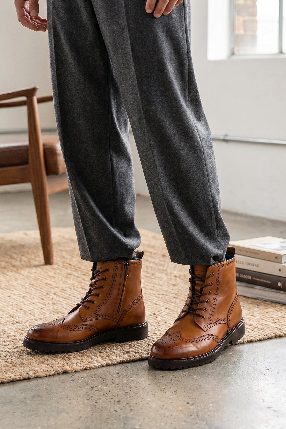 Man wearing Graham tan leather brogue boots for men with classic perforated detailing, ideal for dressy and smart-casual occasions.