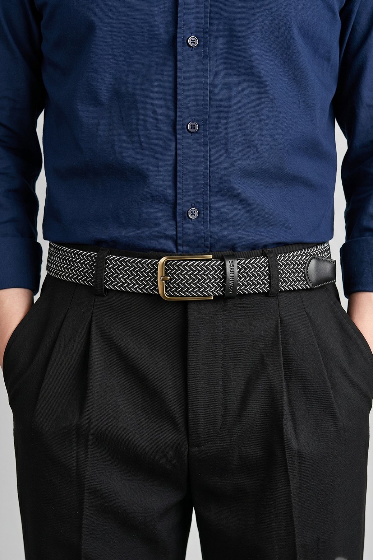 Man wearing Oswin Hyde Bert belt - Black elastic webbing for formal and smart-casual outfits