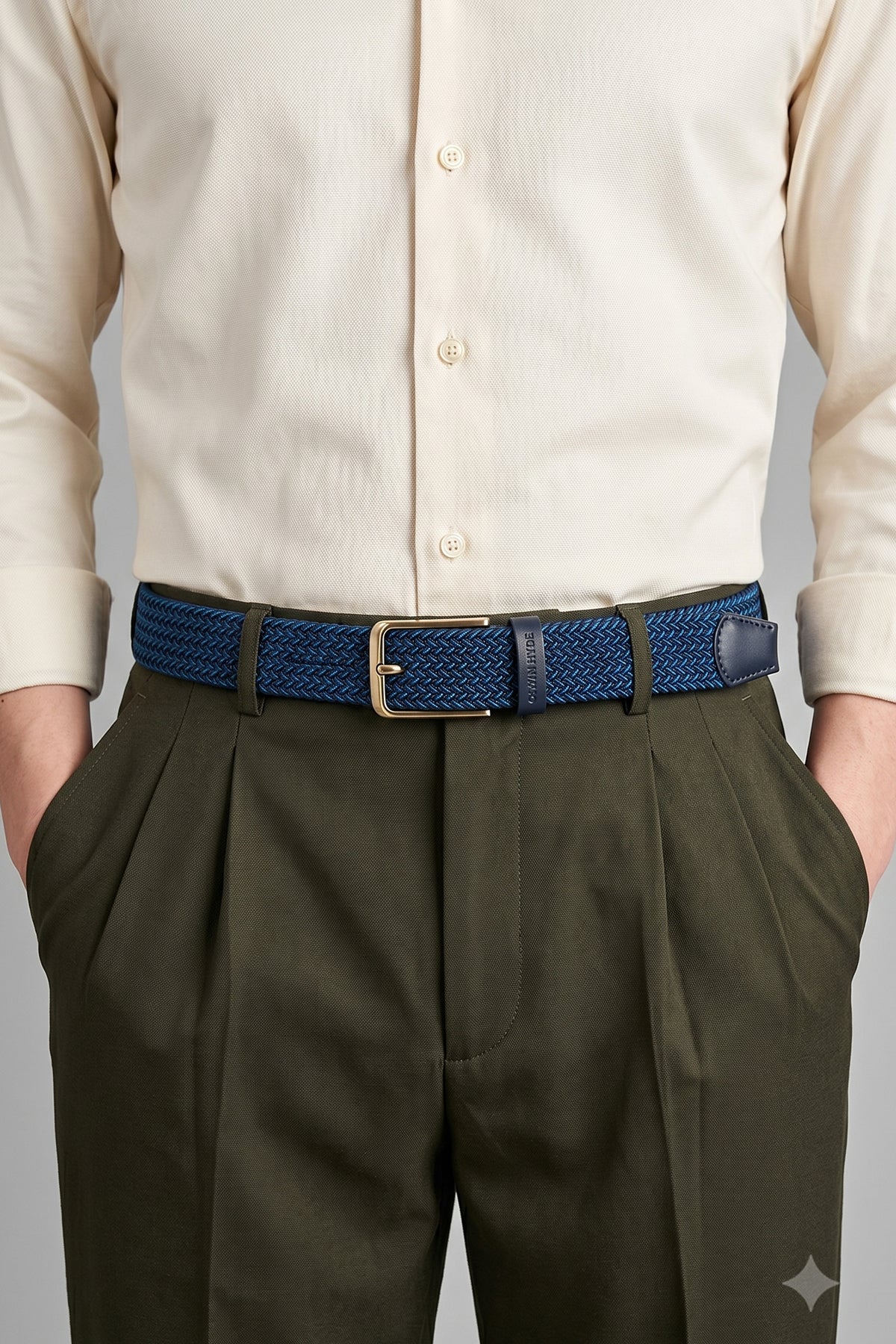 Man wearing Bert Blue Elastic Belt for men with vibrant blue woven webbing, ideal for weddings and casual everyday wear.