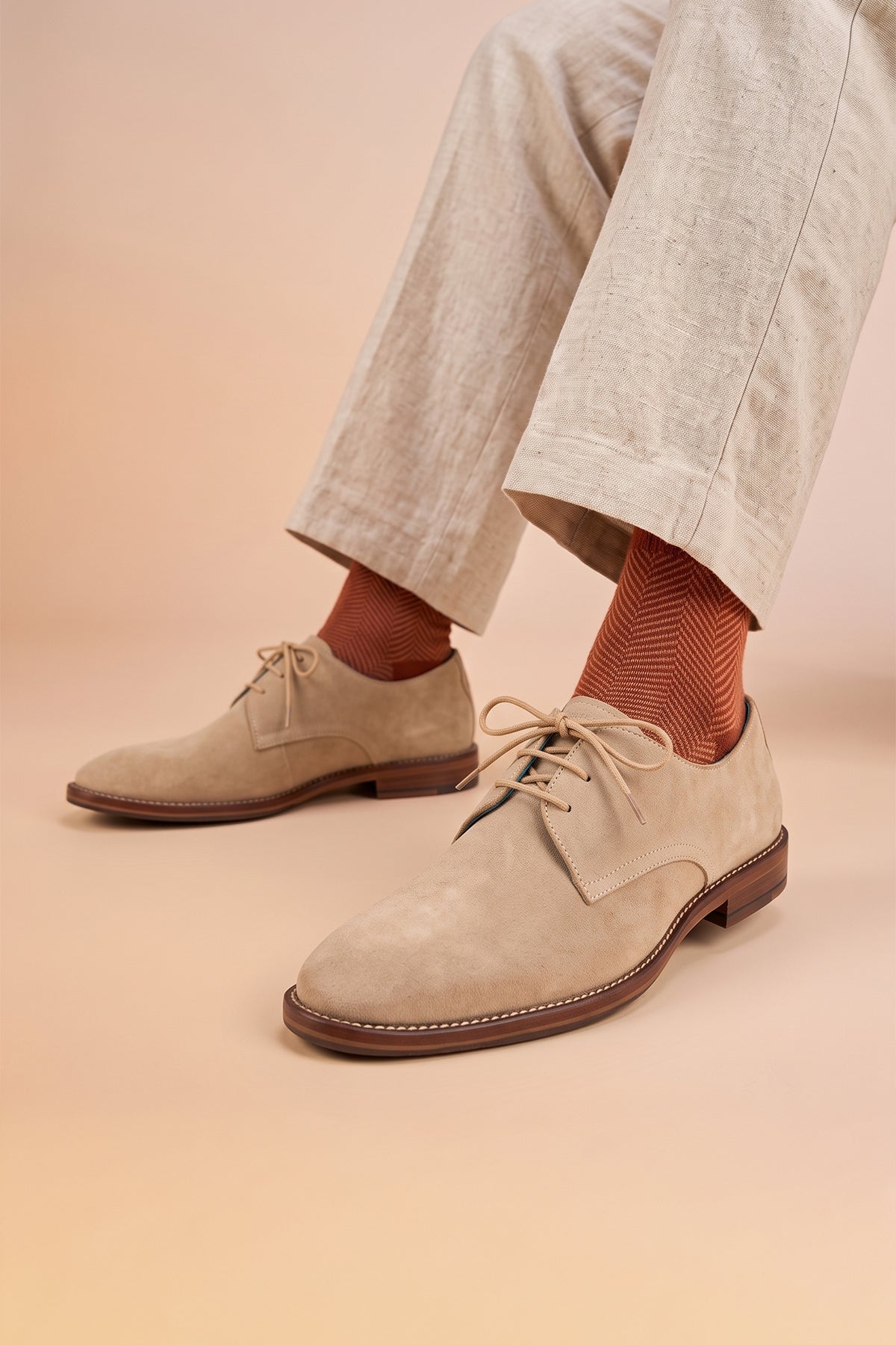 Model wearing Nathan sand suede leather Derby shoes for men featuring a 3-eyelet design, breathable lining, and durable leather sole for formal and smart casual occasions.