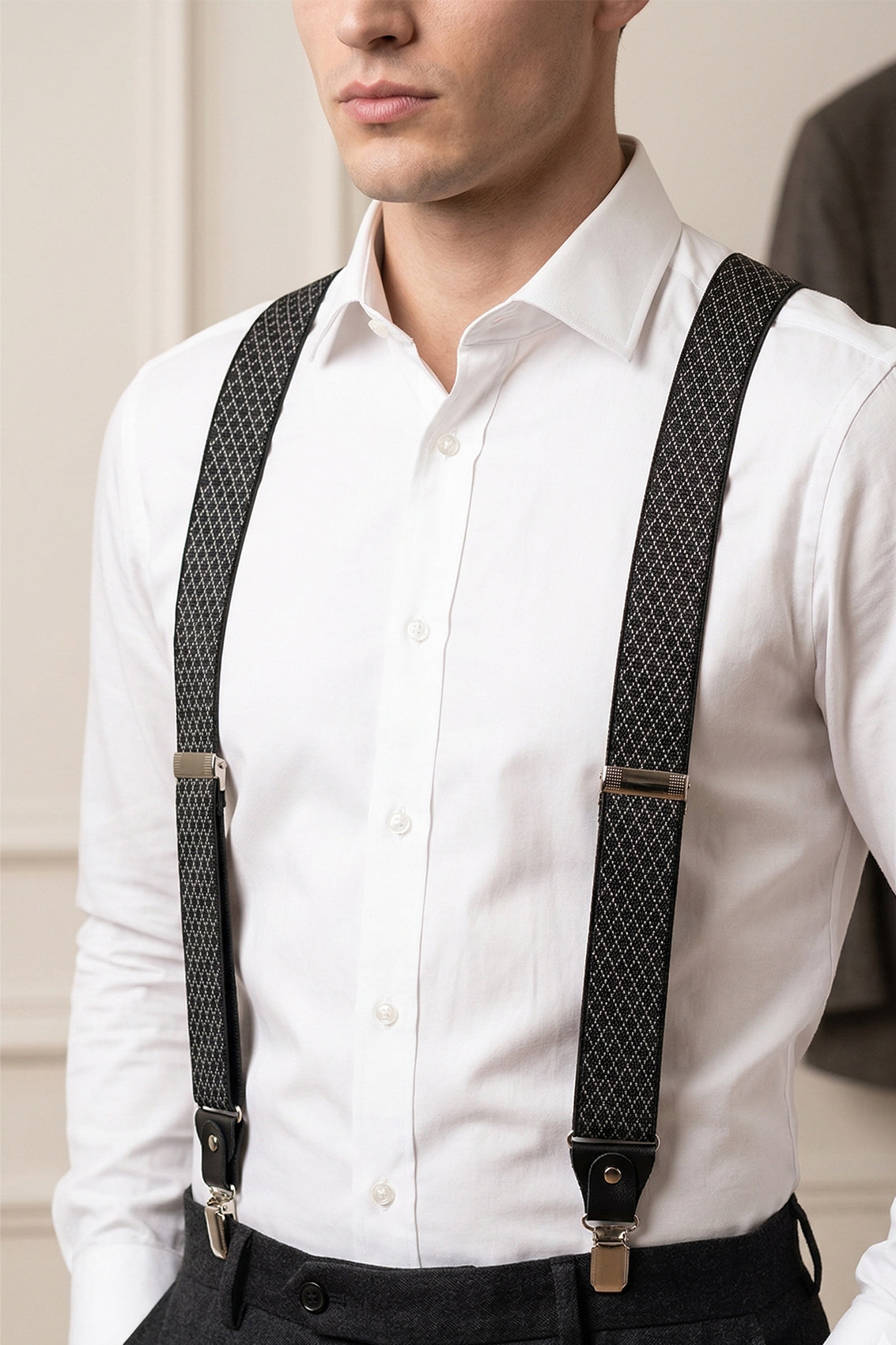 Men’s black geometric pattern clip-on braces with elastic straps and secure metal clips, ideal for weddings, business attire, or refined casual looks.