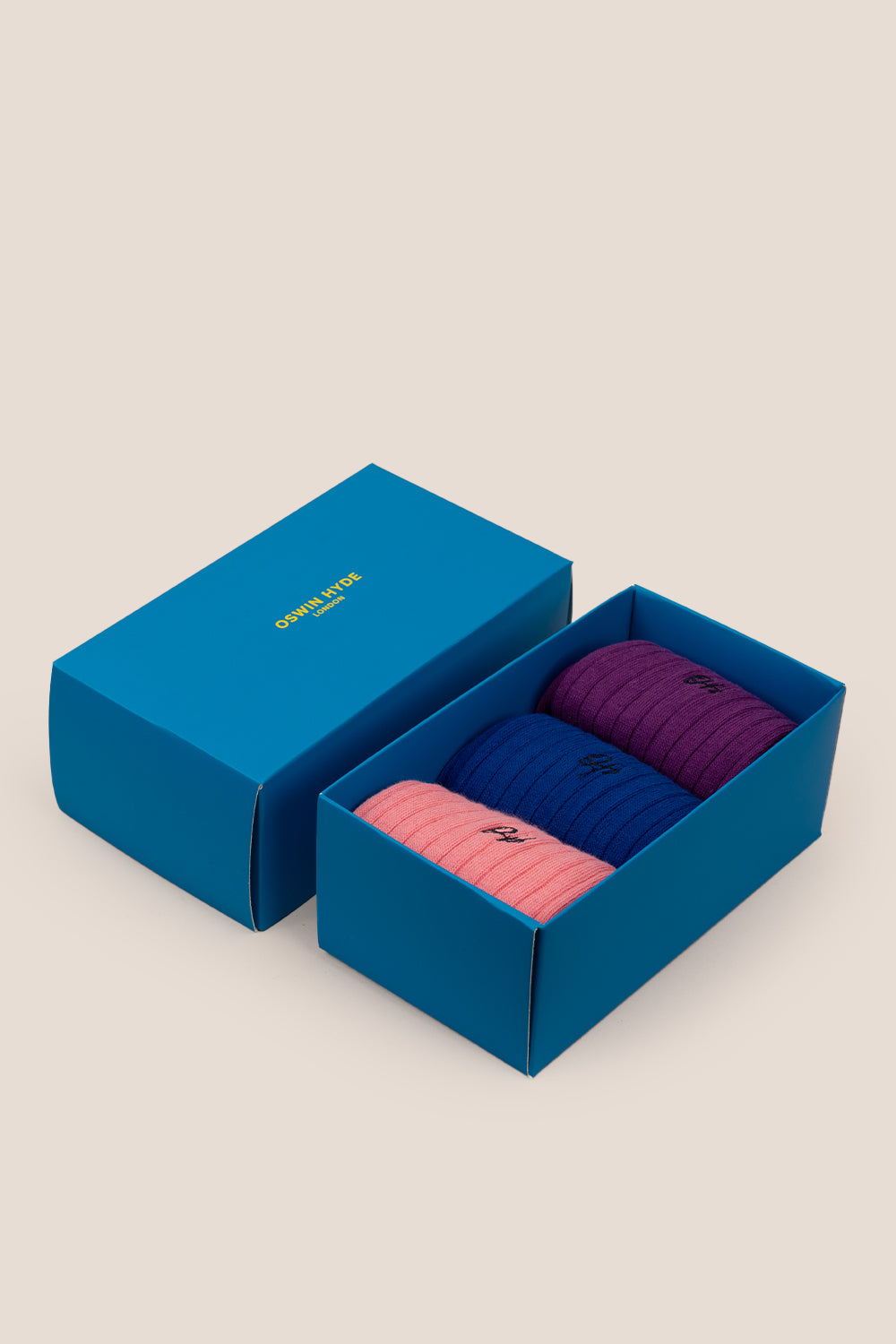 Oswin Hyde Statement three pack socks in purple, blue, and pink for men, offering bold luxury and style.