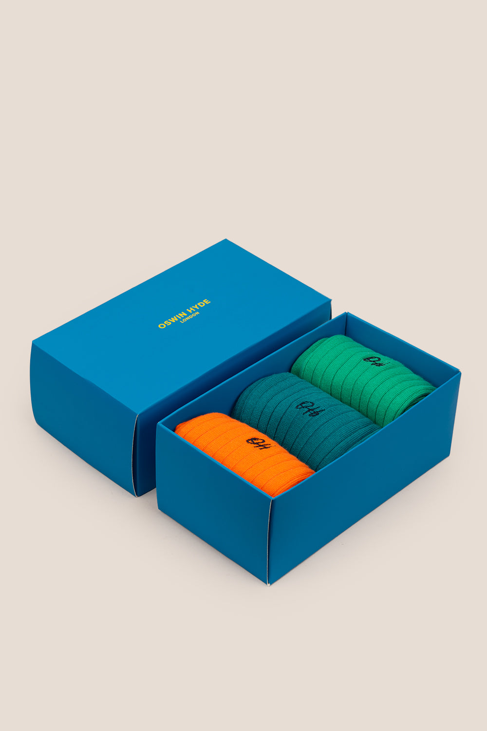 Oswin Hyde Brave three pack socks in Mint Green, Dark Cyan Blue, and Neon Orange for men, offering bold comfort and style.