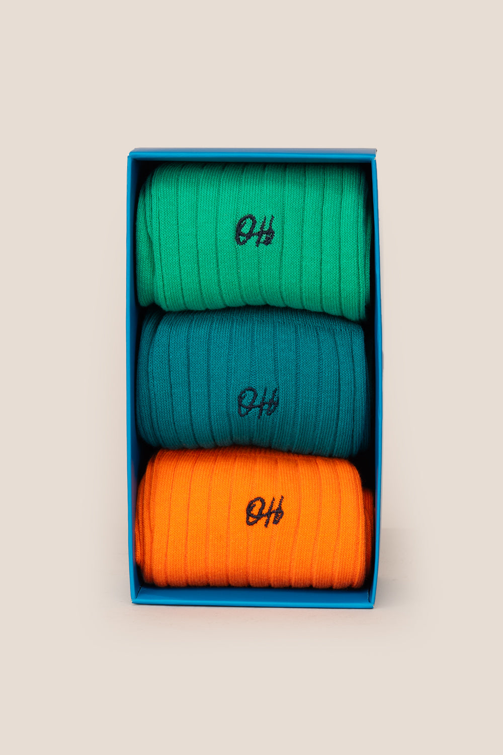 Oswin Hyde Brave three pack socks in Mint Green, Dark Cyan Blue, and Neon Orange for men, offering bold comfort and style.