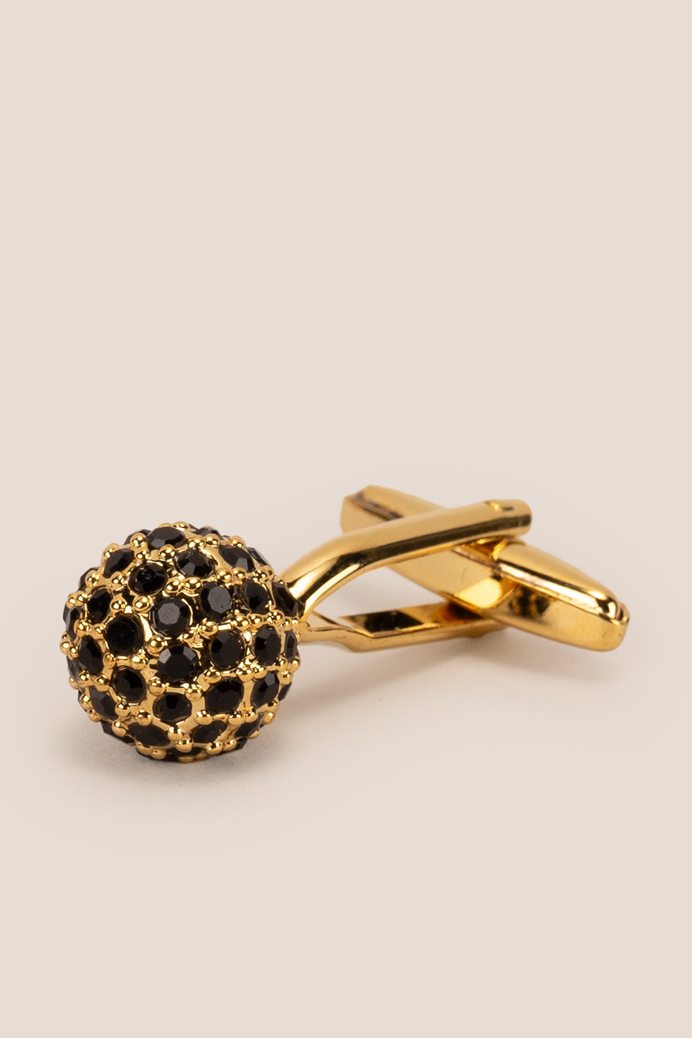 Sphere gold cufflinks with black crystals by Oswin Hyde – luxury men’s formal accessory featuring polished gold finish and elegant crystal inlay.