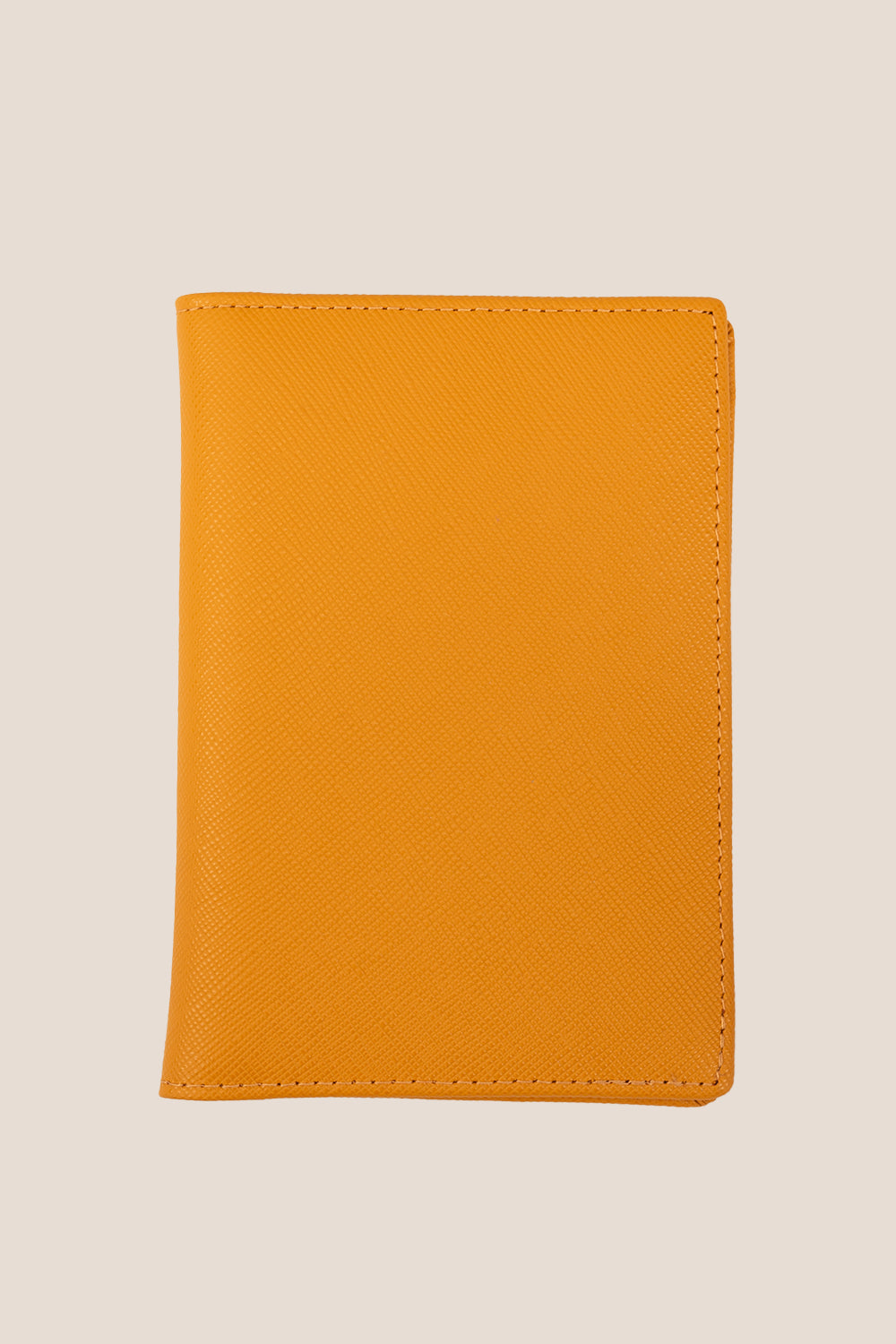 Tan saffiano leather men’s passport holder by Oswin Hyde – slim and stylish travel accessory with secure slot and textured finish.