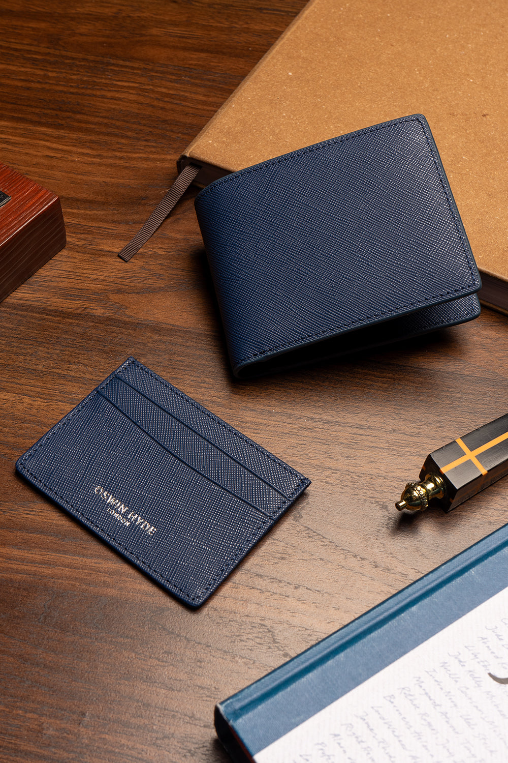 Marylebone navy saffiano leather bi-fold wallet for men by Oswin Hyde – slim luxury wallet with multiple card slots and durable textured leather finish.