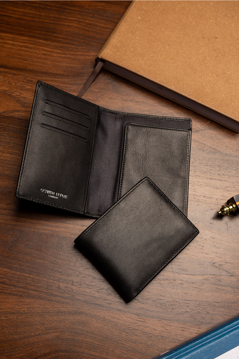 Oxford black luxury leather bi-fold wallet for men by Oswin Hyde – premium smooth leather wallet with silver embossed logo and multiple card slots.