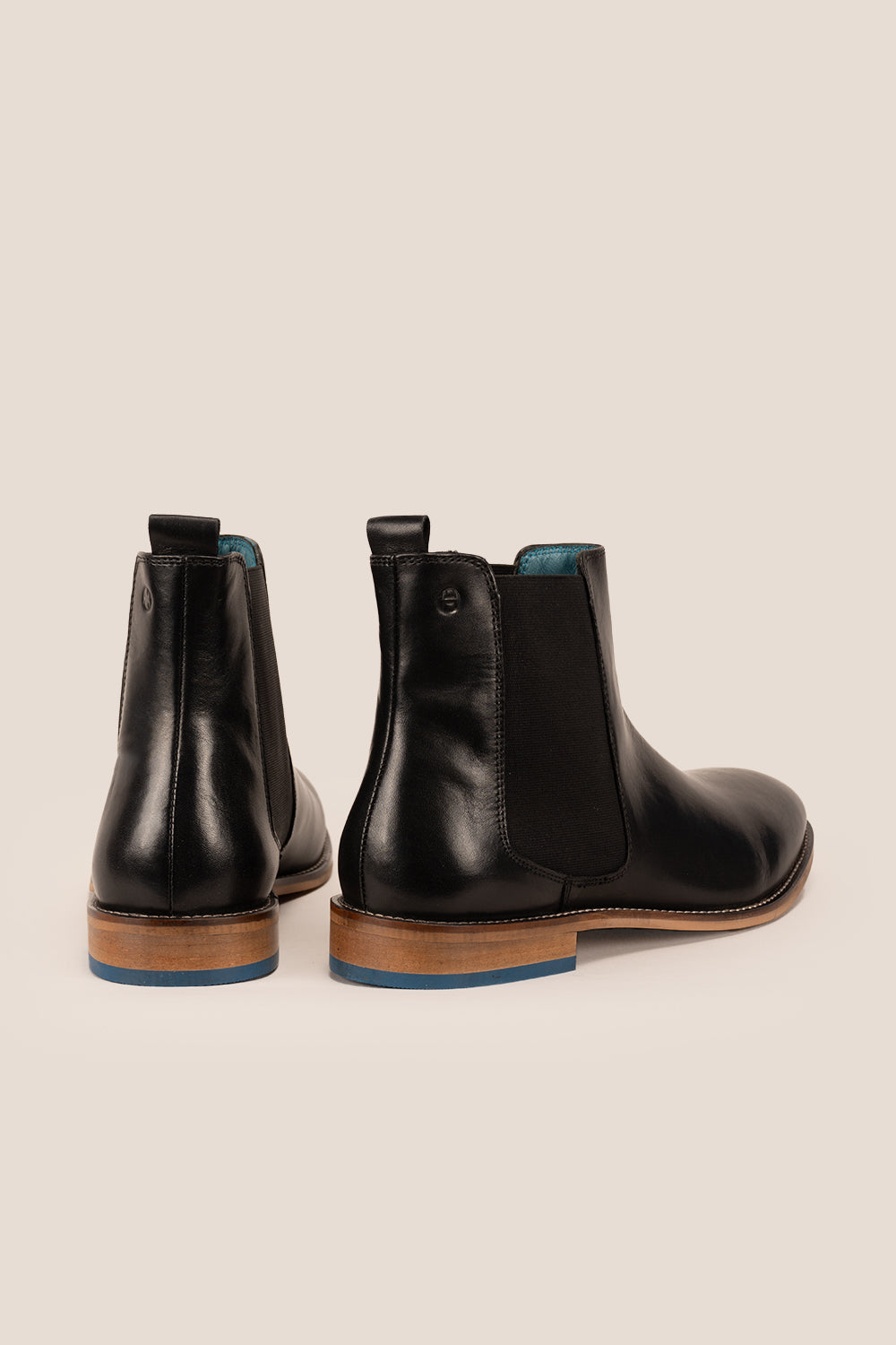 Dennis black leather Chelsea boots for men by Oswin Hyde – luxury slip-on boots with sleek silhouette, elastic sides, and premium formal styling.