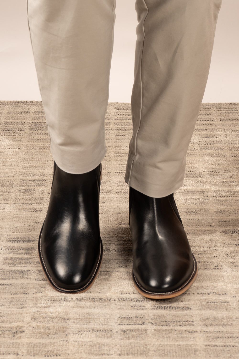Dennis black leather Chelsea boots for men by Oswin Hyde – luxury slip-on boots with sleek silhouette, elastic sides, and premium formal styling.