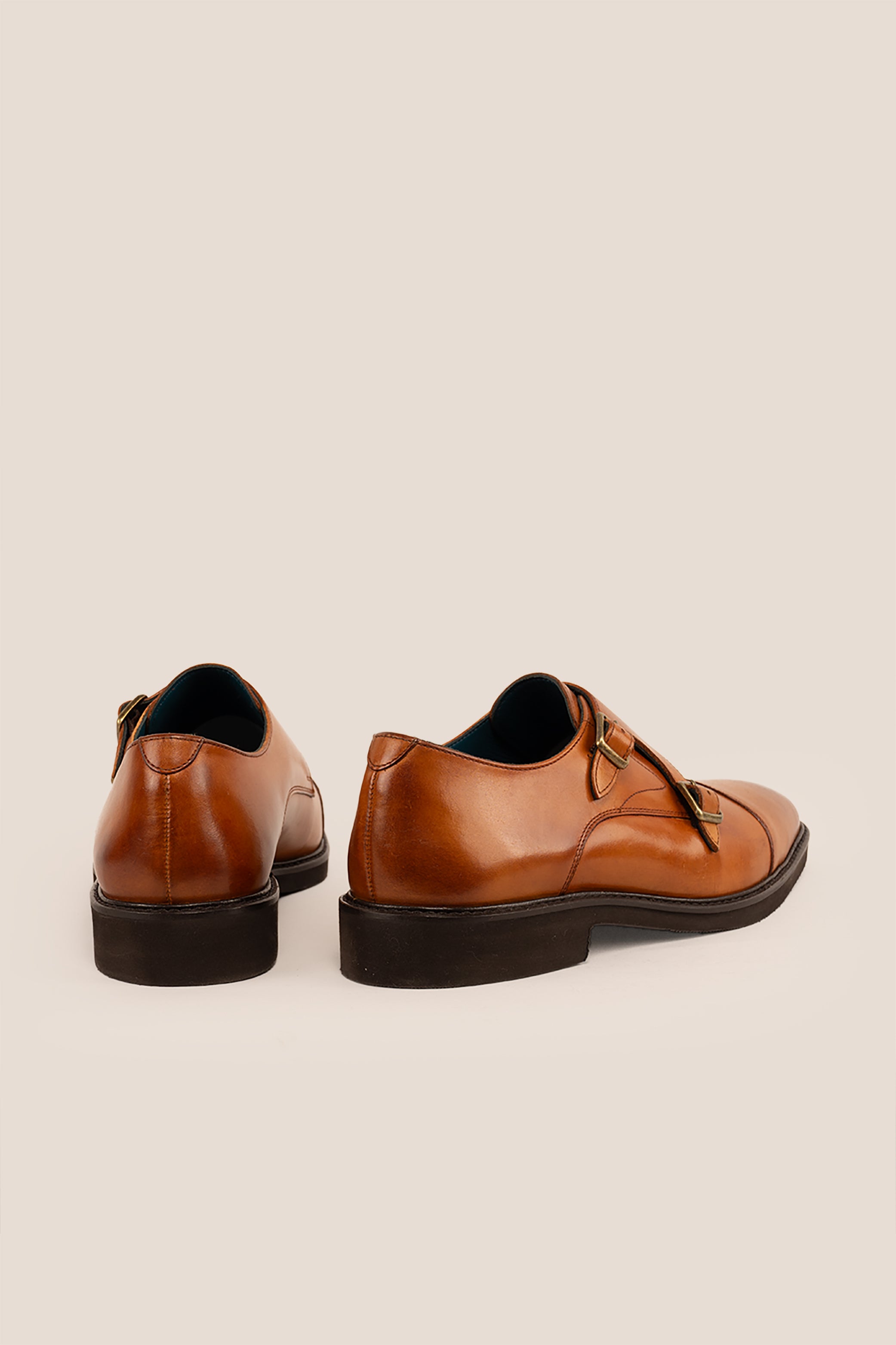 Garson tan monk strap leather men’s shoes with premium craftsmanship, sleek design, and classic buckle detail for formal and office wear.