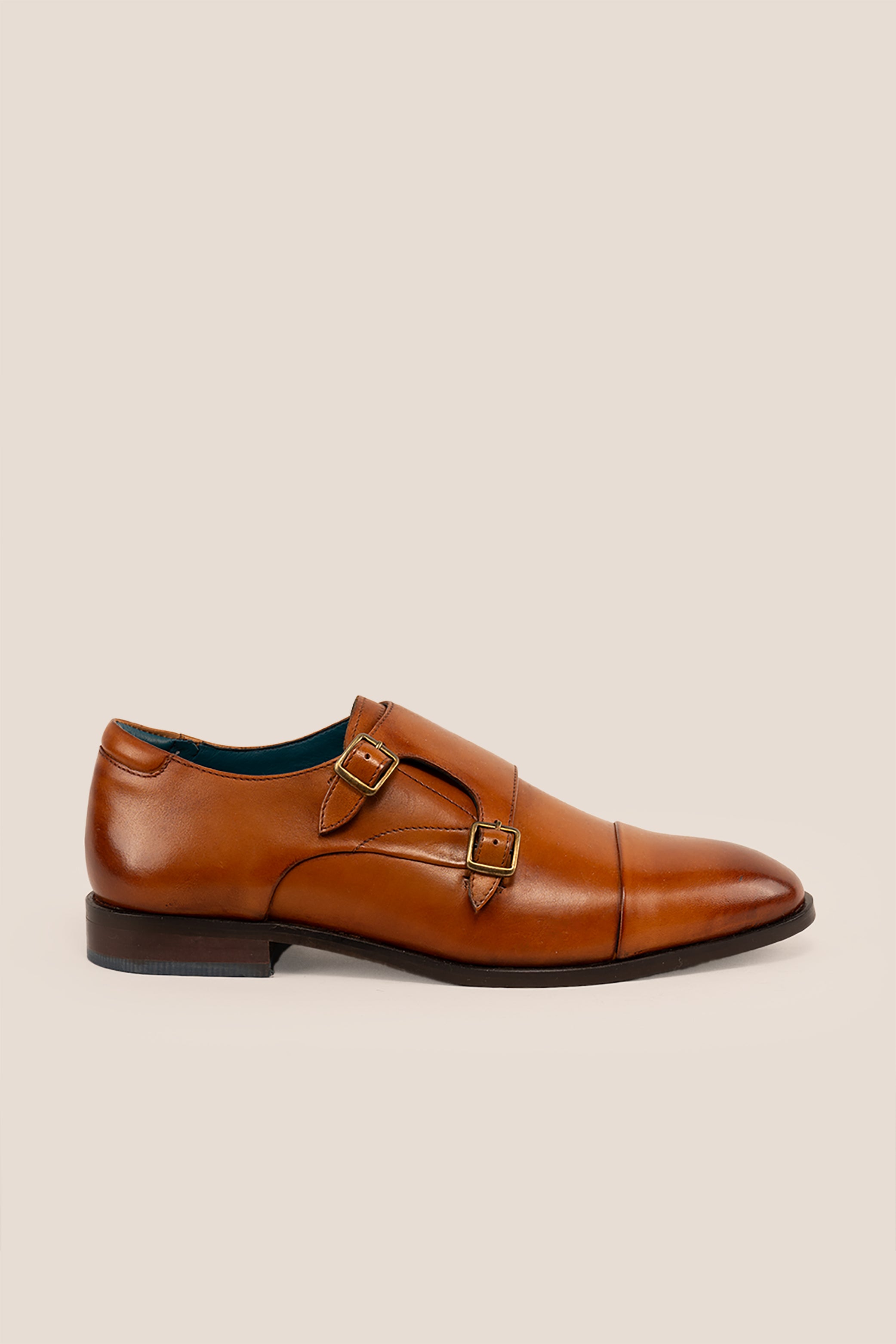Hadley tan monk strap leather men’s shoes with single buckle design, crafted in high-quality leather and finished with a sleek leather sole.