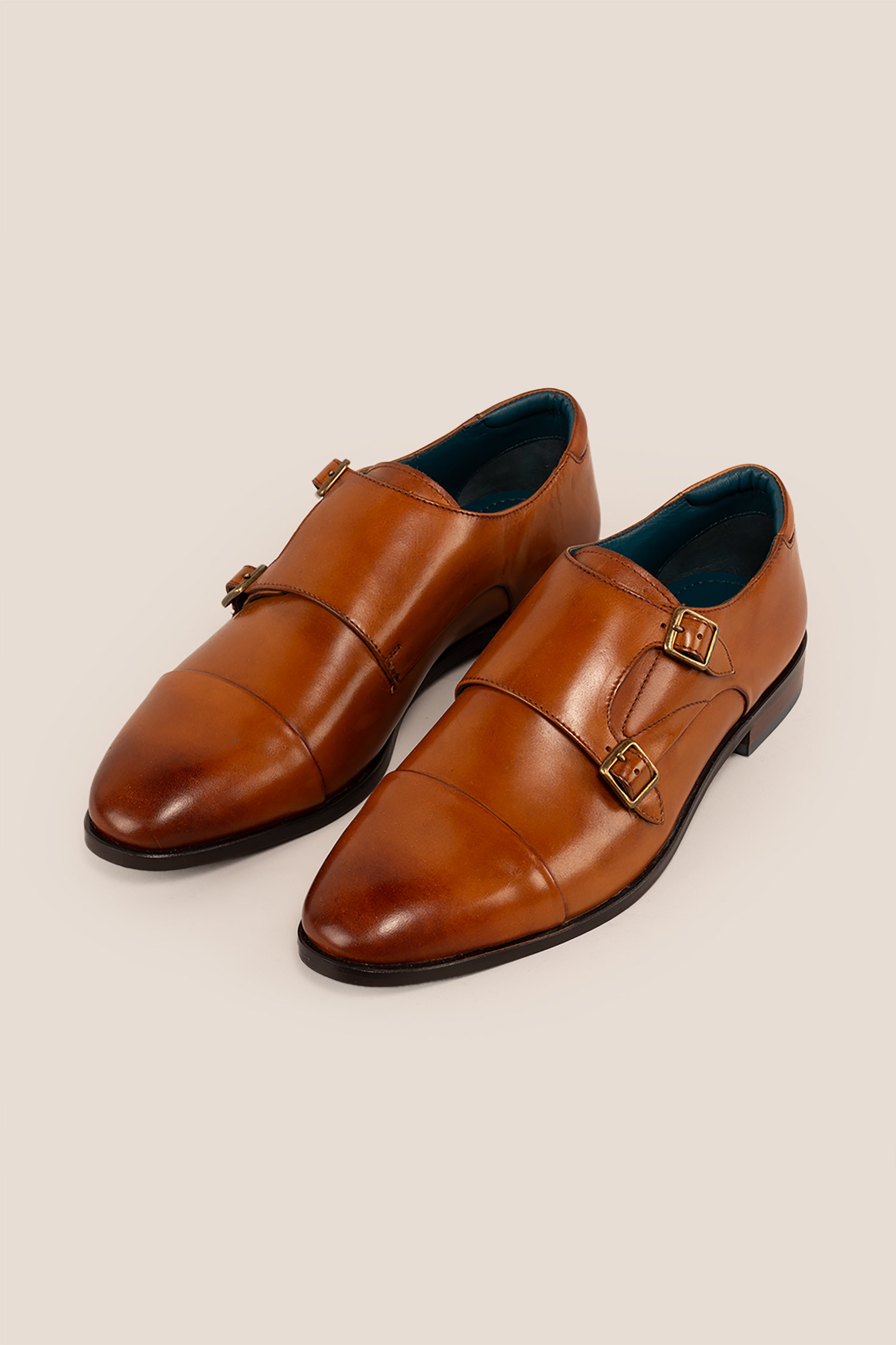 Hadley tan monk strap leather men’s shoes with single buckle design, crafted in high-quality leather and finished with a sleek leather sole.
