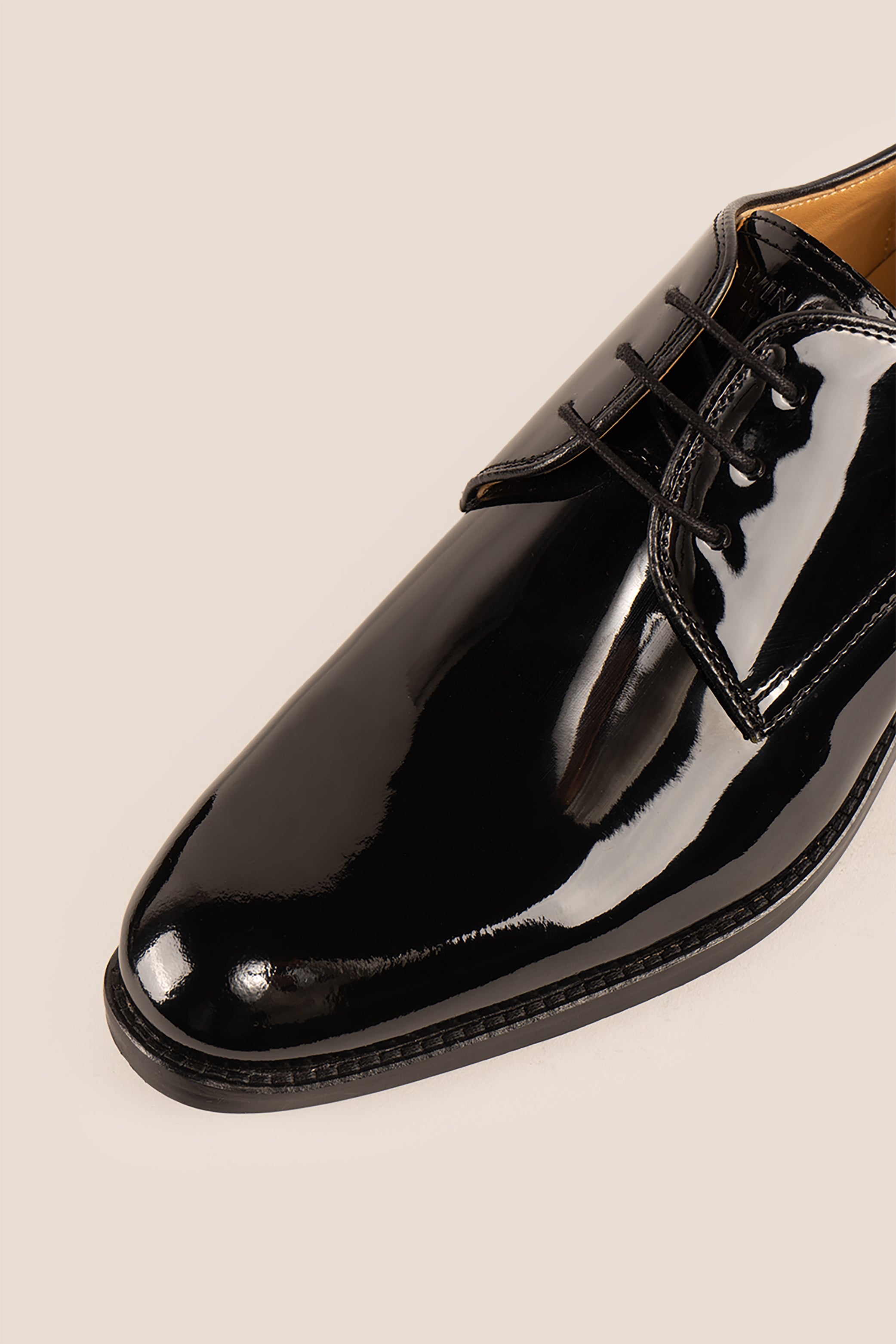 Edison Black patent derby men’s leather shoes with three-eyelet design and polished finish, perfect for formal occasions.