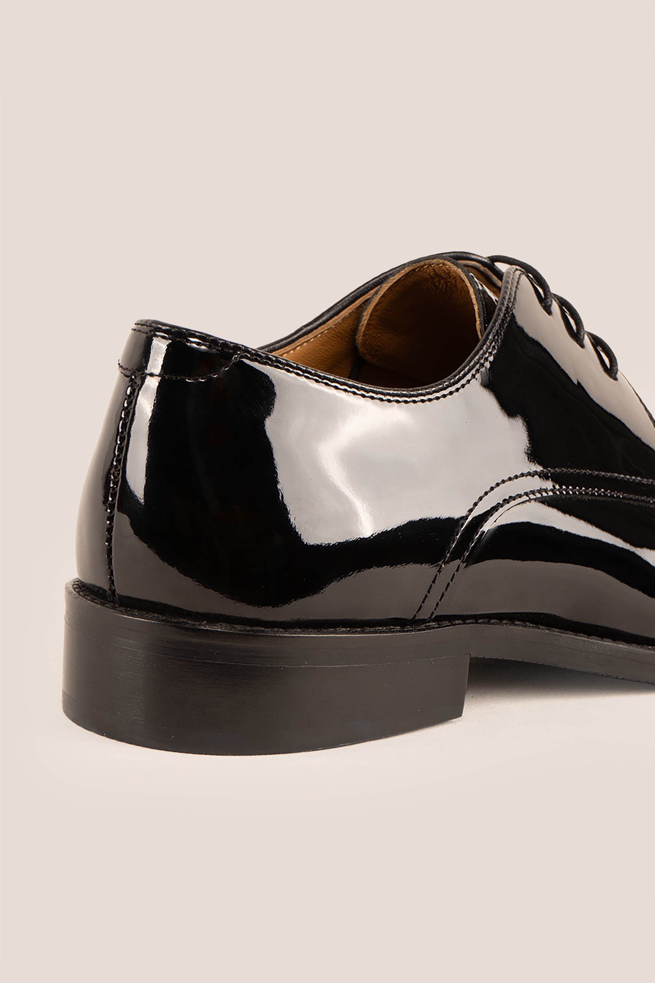 Edison Black patent derby men’s leather shoes with three-eyelet design and polished finish, perfect for formal occasions.