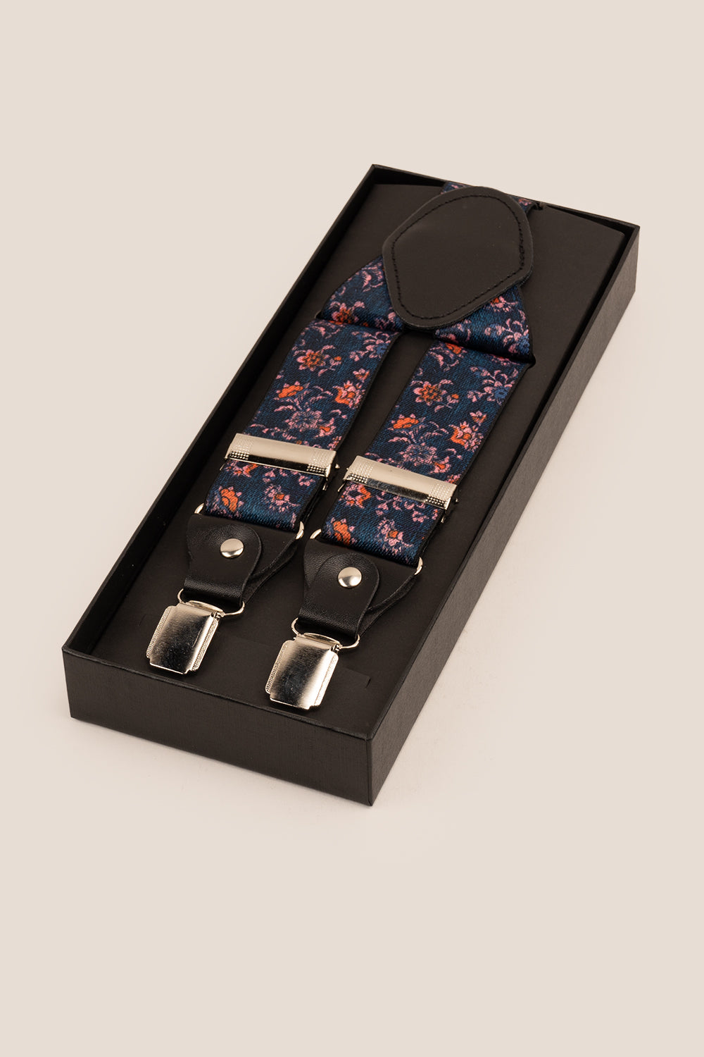 Men’s blue floral clip‑on braces and suspenders with elastic straps and metal clips, perfect for wedding, business, or refined casual wear.