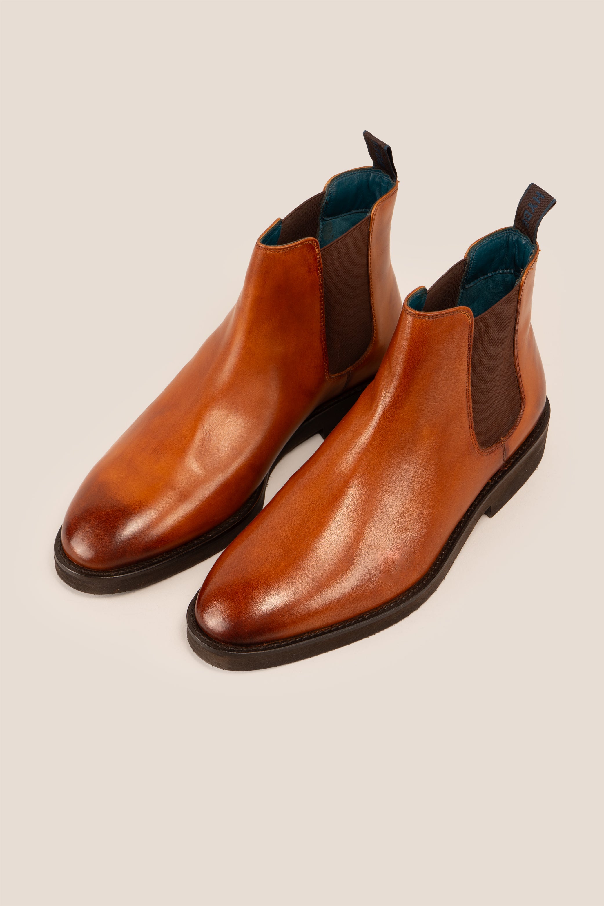 Michael tan leather Chelsea boots for men with elastic sides and pull tab, perfect for smart-casual and formal wear.