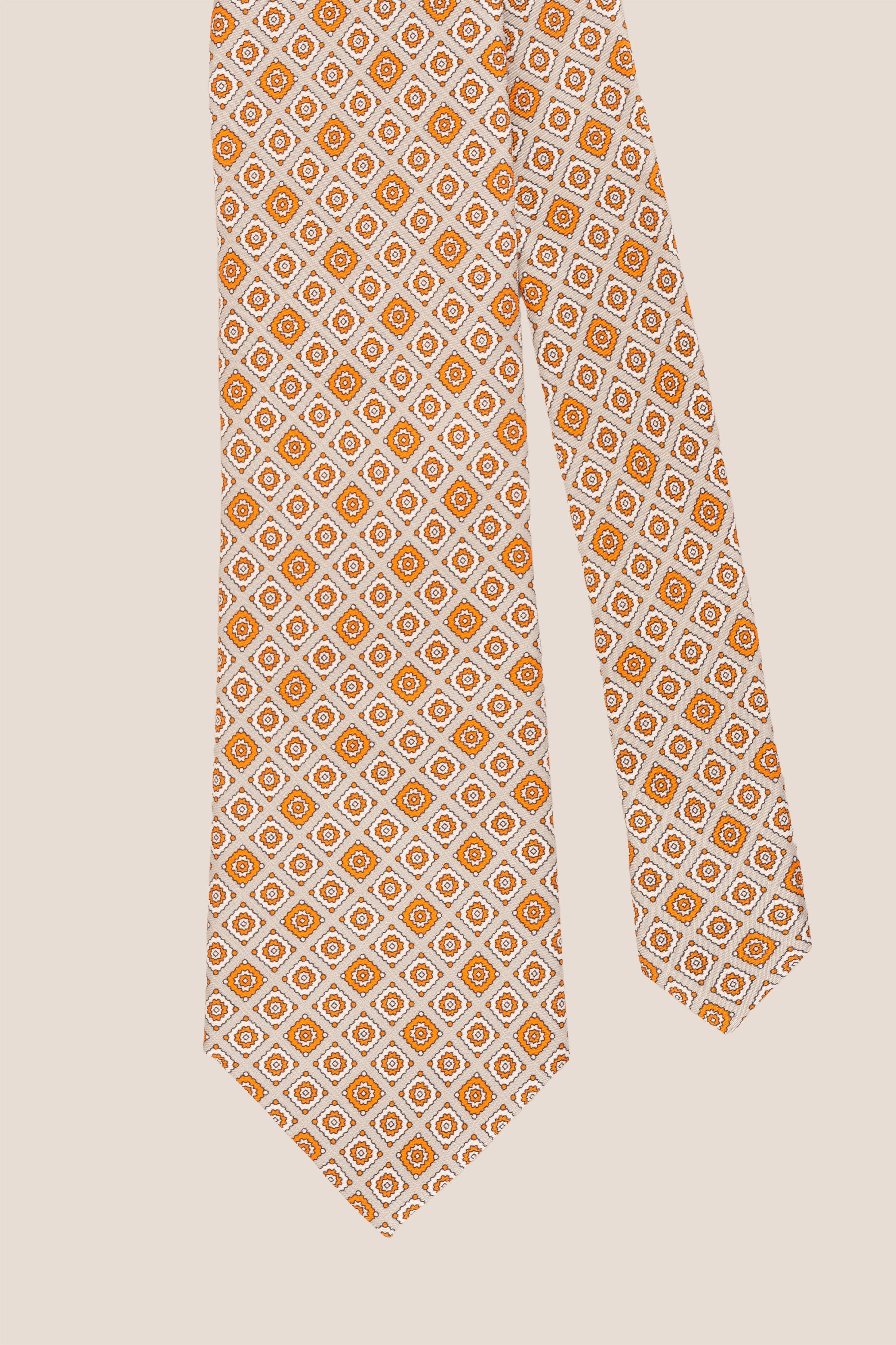Orange Motif Print Silk Tie with intricate design, offering luxury and sophistication for special occasions.