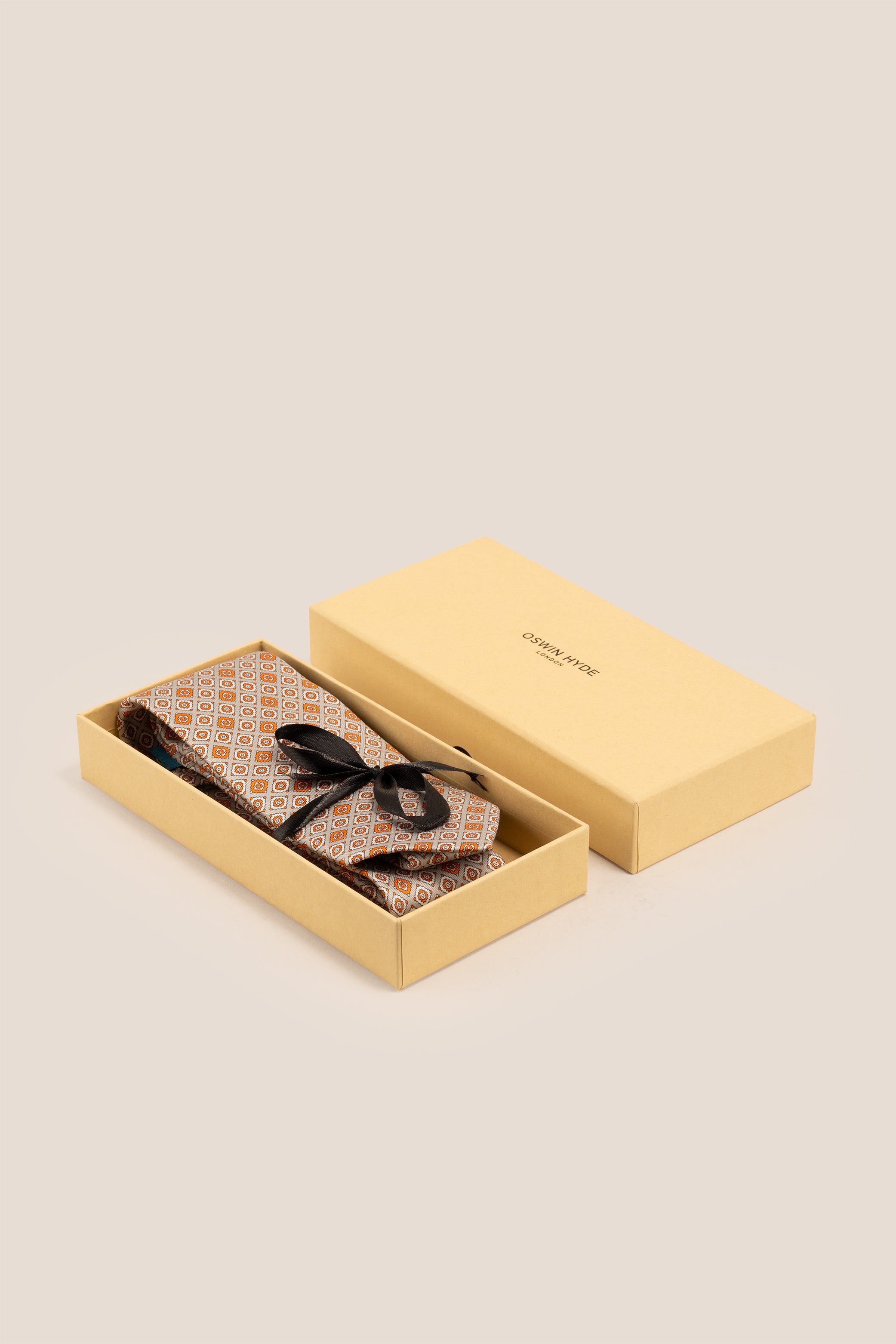 Orange Motif Print Silk Tie with intricate design, offering luxury and sophistication for special occasions.