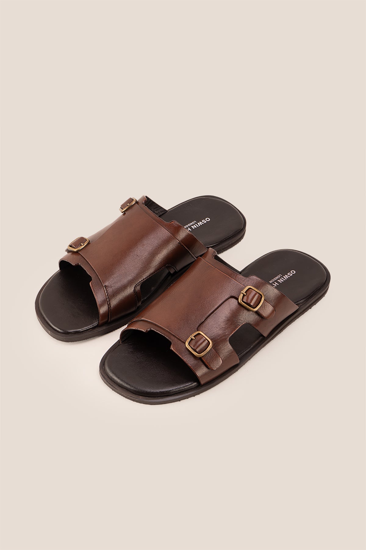 Logan Brown men’s leather sandals with premium stitching and timeless design, ideal for warm-weather comfort and smart-casual summer looks.